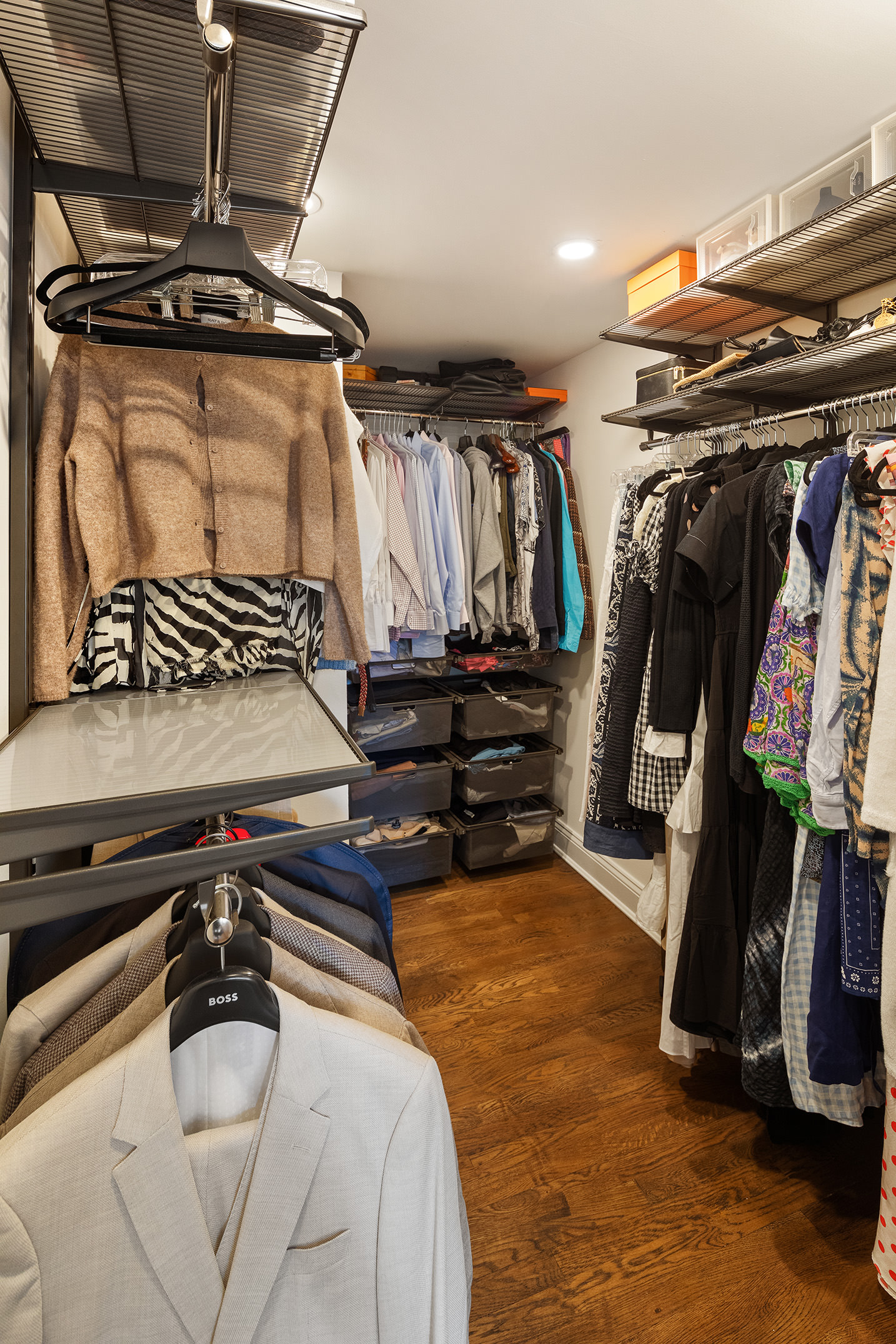 250 Mercer Street, Unit C302 Manhattan, NY 10012 - Photo 9 of 24 a view of walk in closet with clothes and shoes