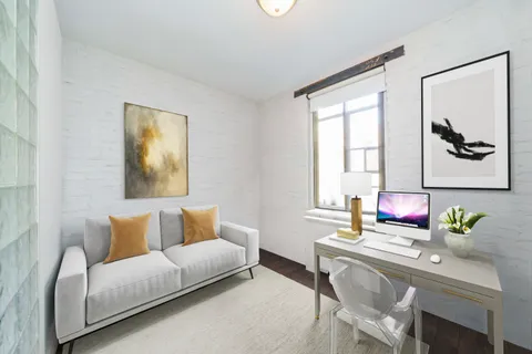 a living room with furniture and window
