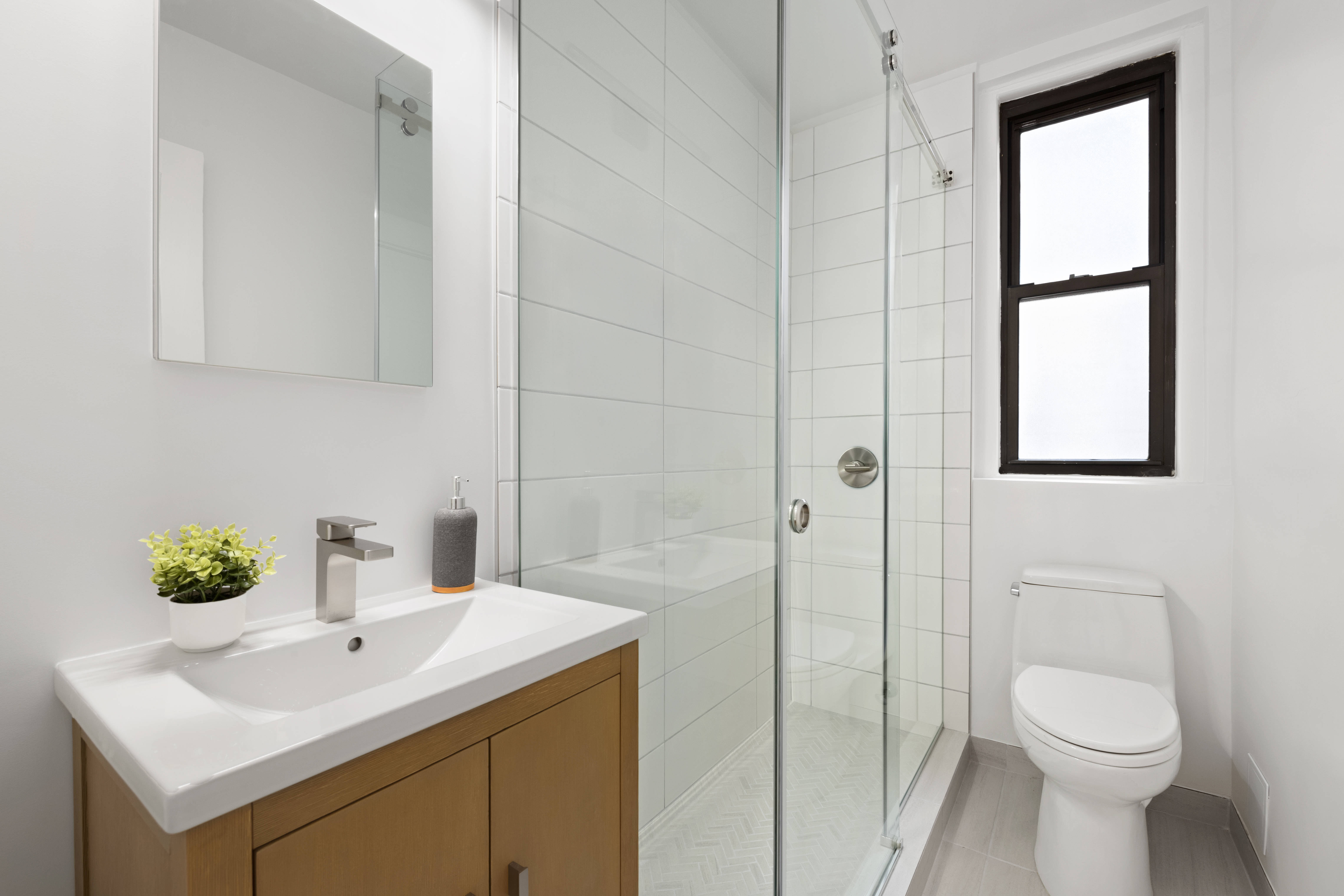 33 Riverside Drive, Unit 5D Manhattan, NY 10023 - Photo 6 of 7 a bathroom with a sink toilet and vanity