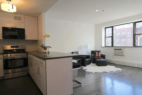 a kitchen with a sink and a stove top oven