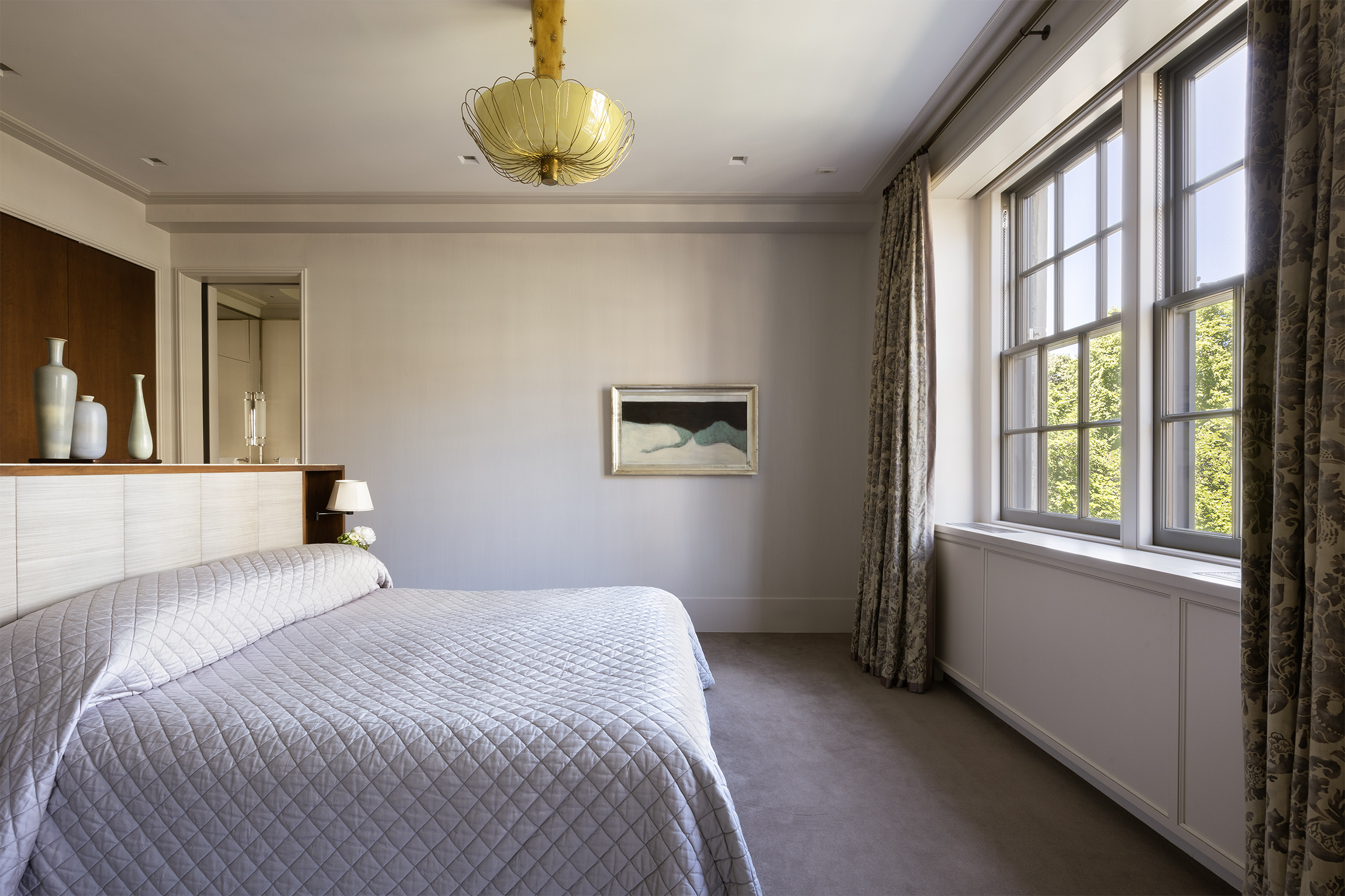 2 East 70th Street, Unit 4A Manhattan, NY 10021 - Photo 5 of 17 a bedroom with a bed and a large window