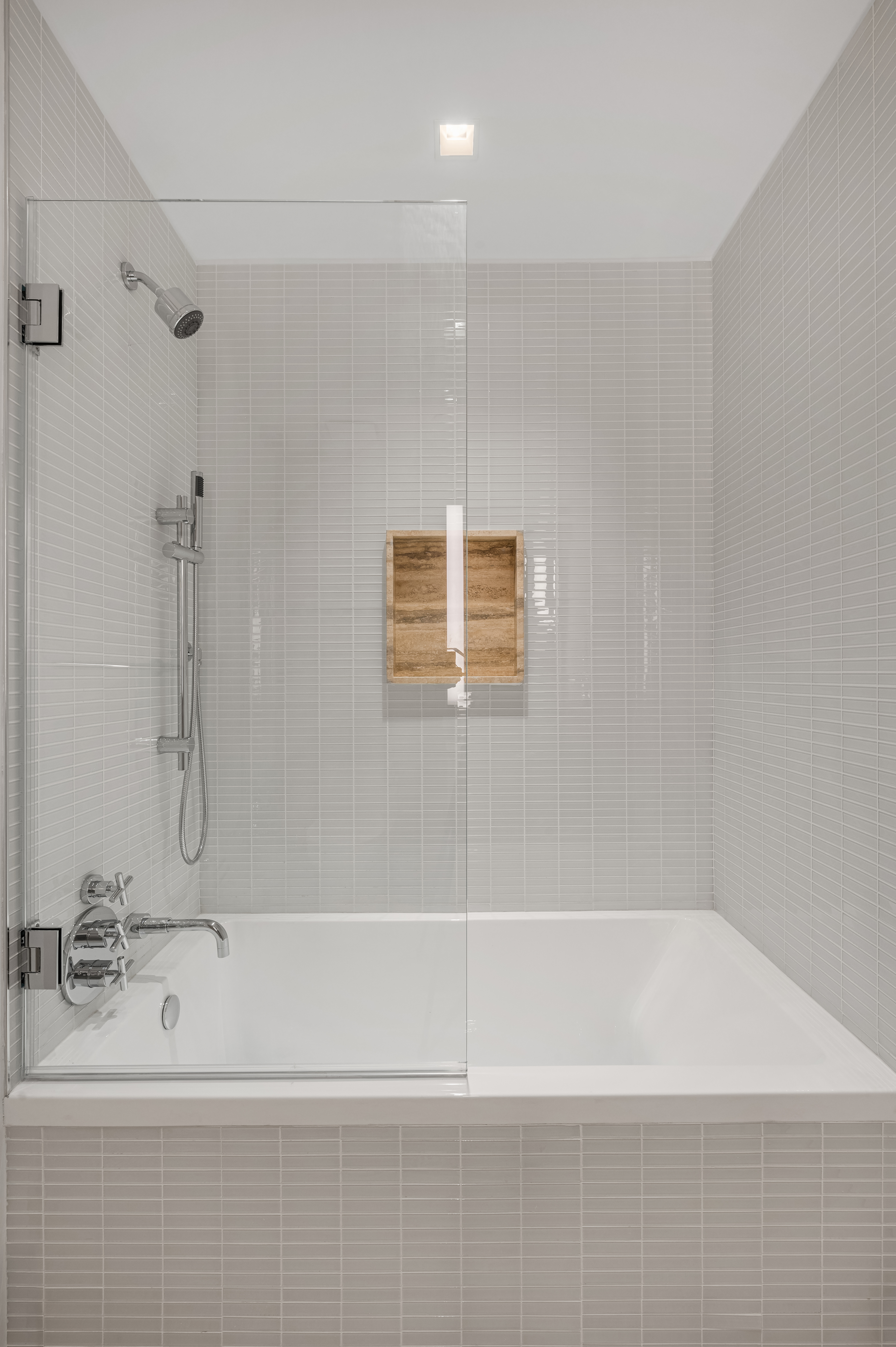 1 Wall Street, Unit 915 Manhattan, NY 10005 - Photo 6 of 18 a bathroom with a bathtub and a shower