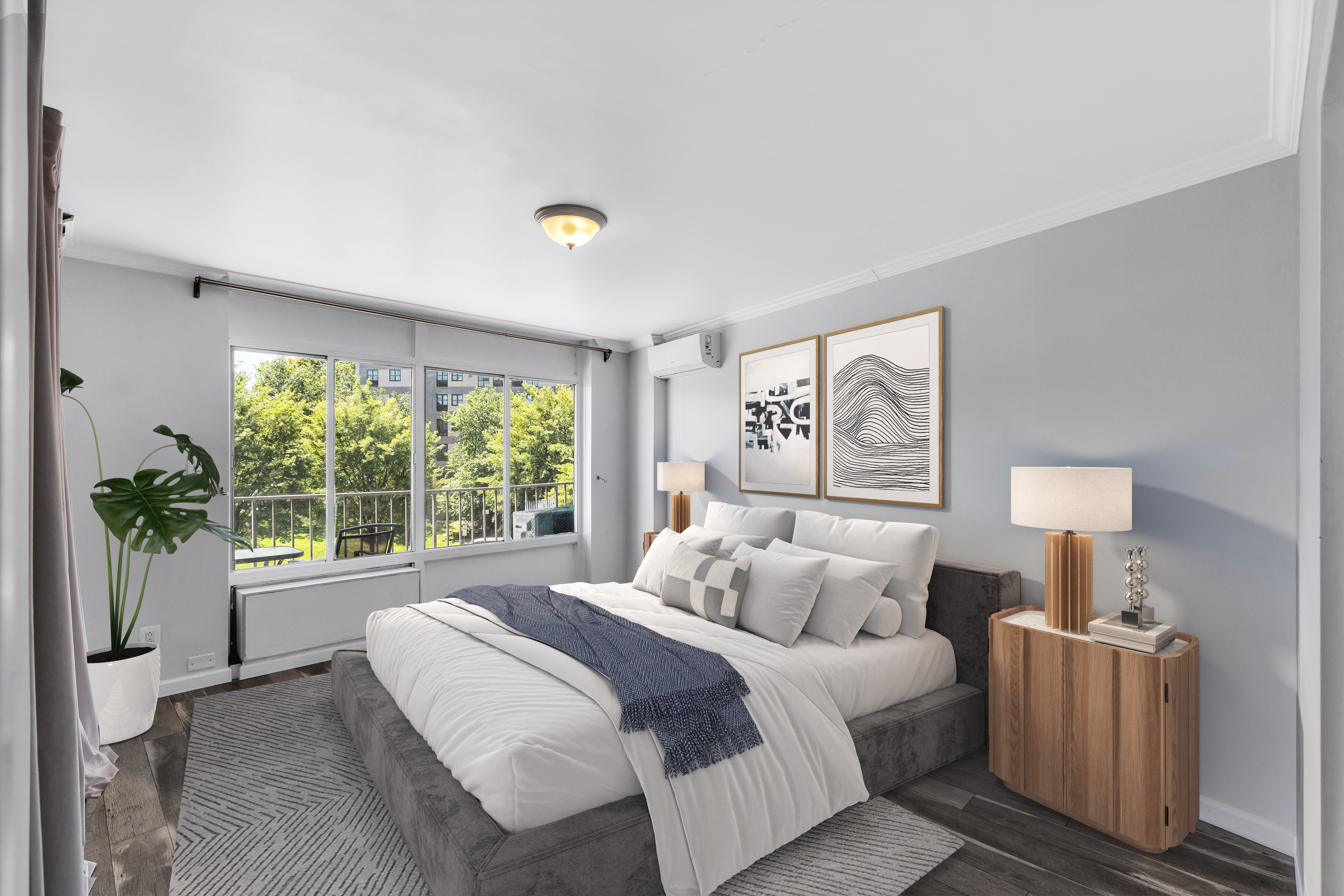 25-40 Shore Boulevard, Unit 2F Queens, NY 11102 - Photo 10 of 31 a bedroom with bed and a night stand