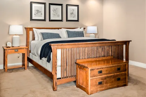 a bedroom with a bed and lamp