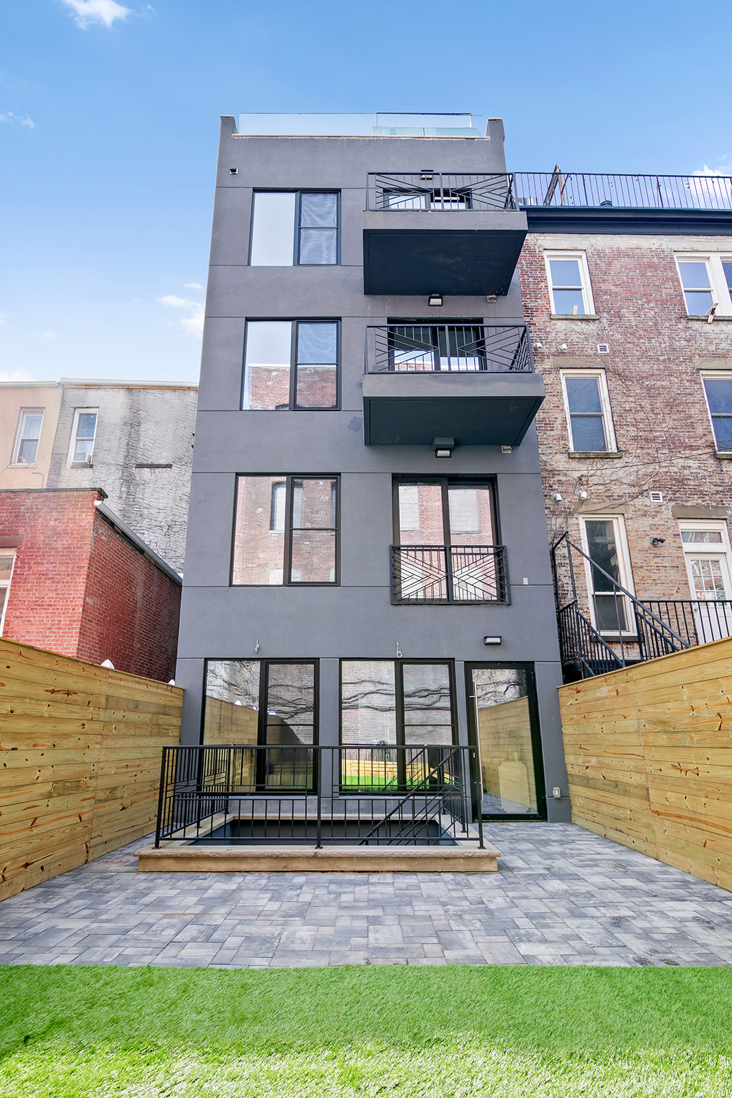 1251 Pacific Street, Unit 1A Brooklyn, NY 11216 - Photo 10 of 13 a front view of a house with garden