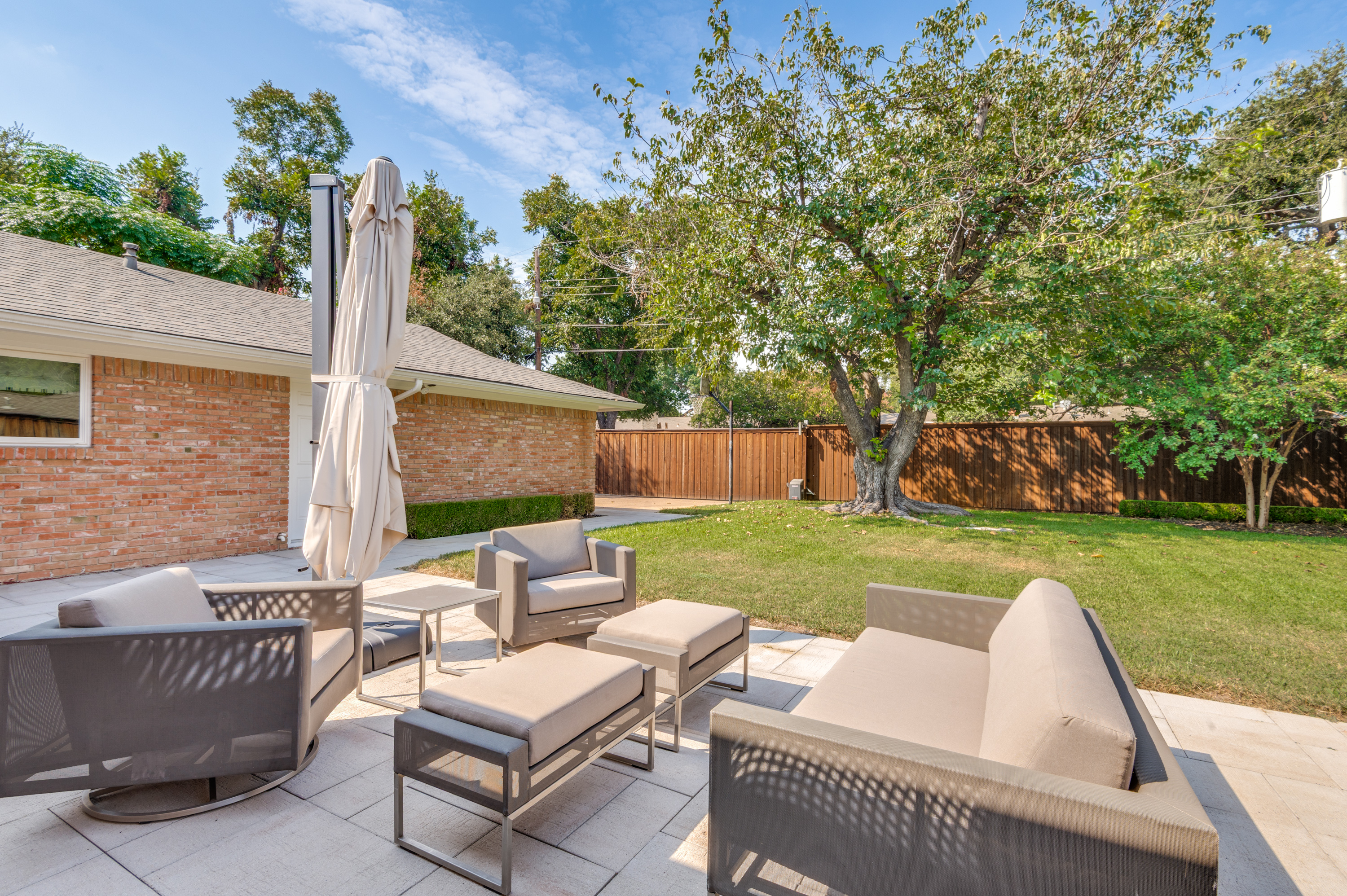 3363 Merrell Road Dallas, TX 75229 - Photo 29 of 29 a view of backyard with seating space and trees