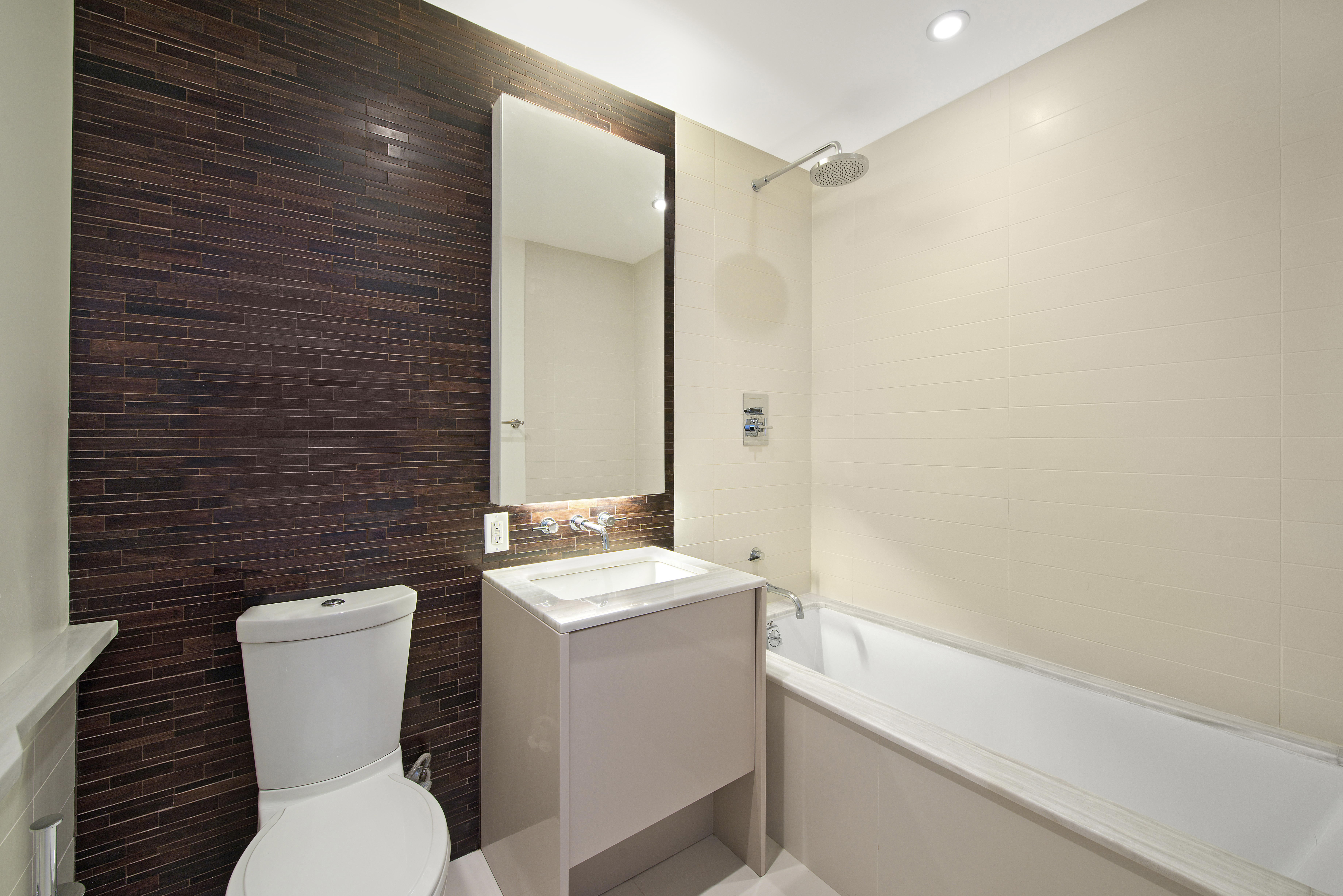 2 Northside Piers, Unit 10B Brooklyn, NY 11249 - Photo 6 of 14 a bathroom with a toilet sink and mirror