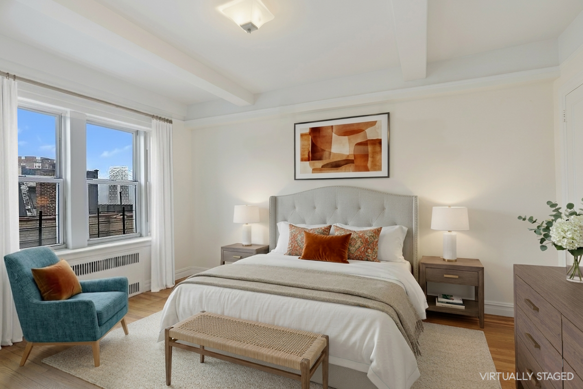250 Cabrini Boulevard, Unit 9E Manhattan, NY 10033 - Photo 9 of 19 a bedroom with a bed and glass window