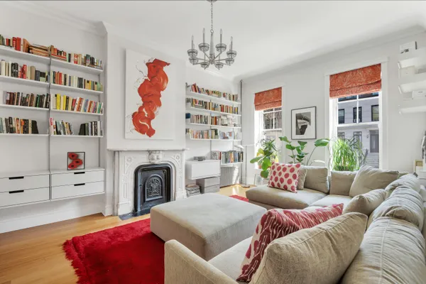 a living room with furniture and a fireplace