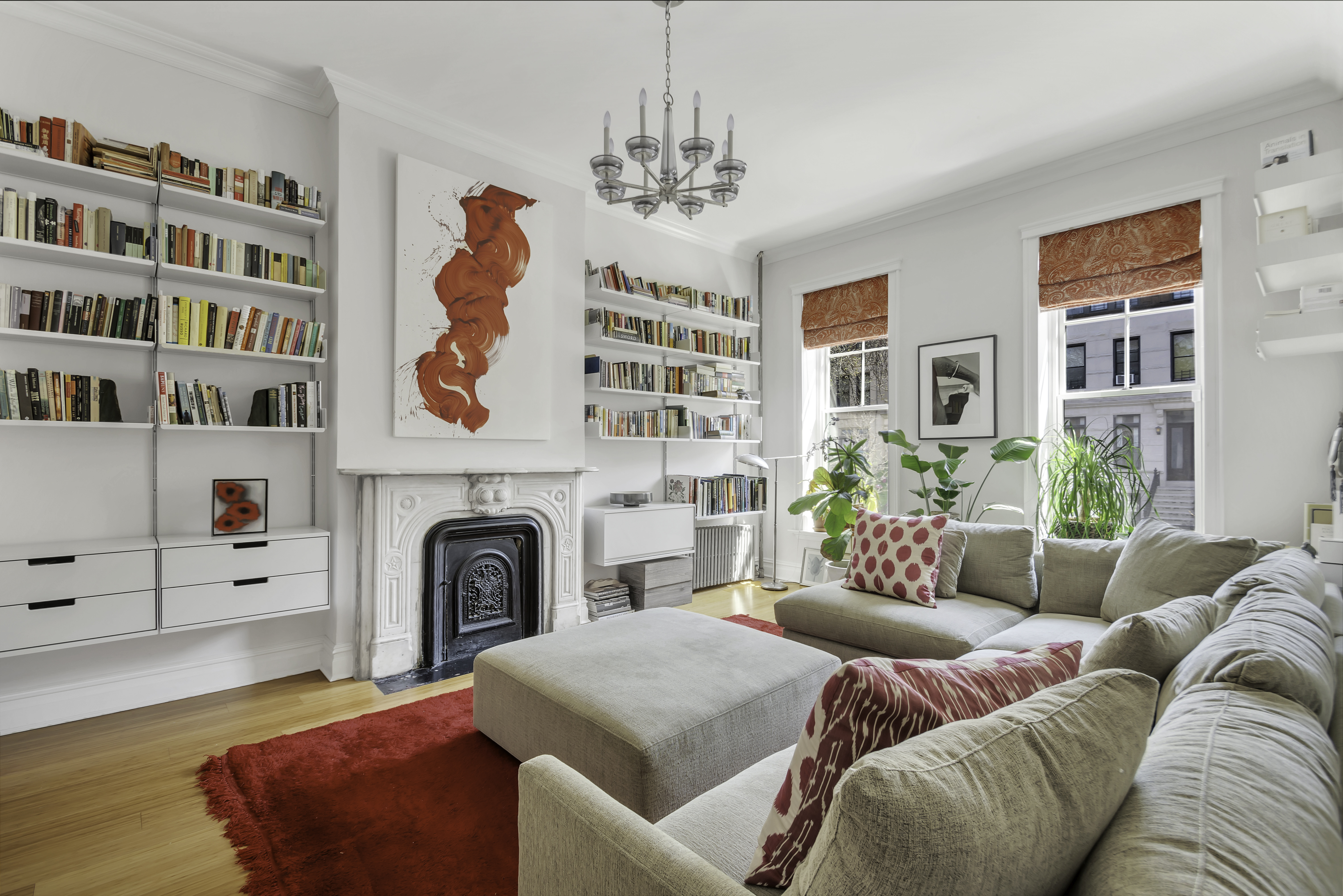 713 Greene Avenue, Unit GARDEN Brooklyn, NY 11221 - Photo 9 of 13 a living room with furniture and a fireplace