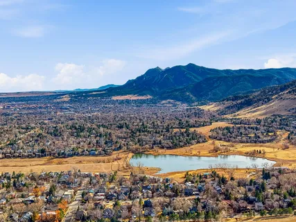 a swimming pool with outdoor seating and yard