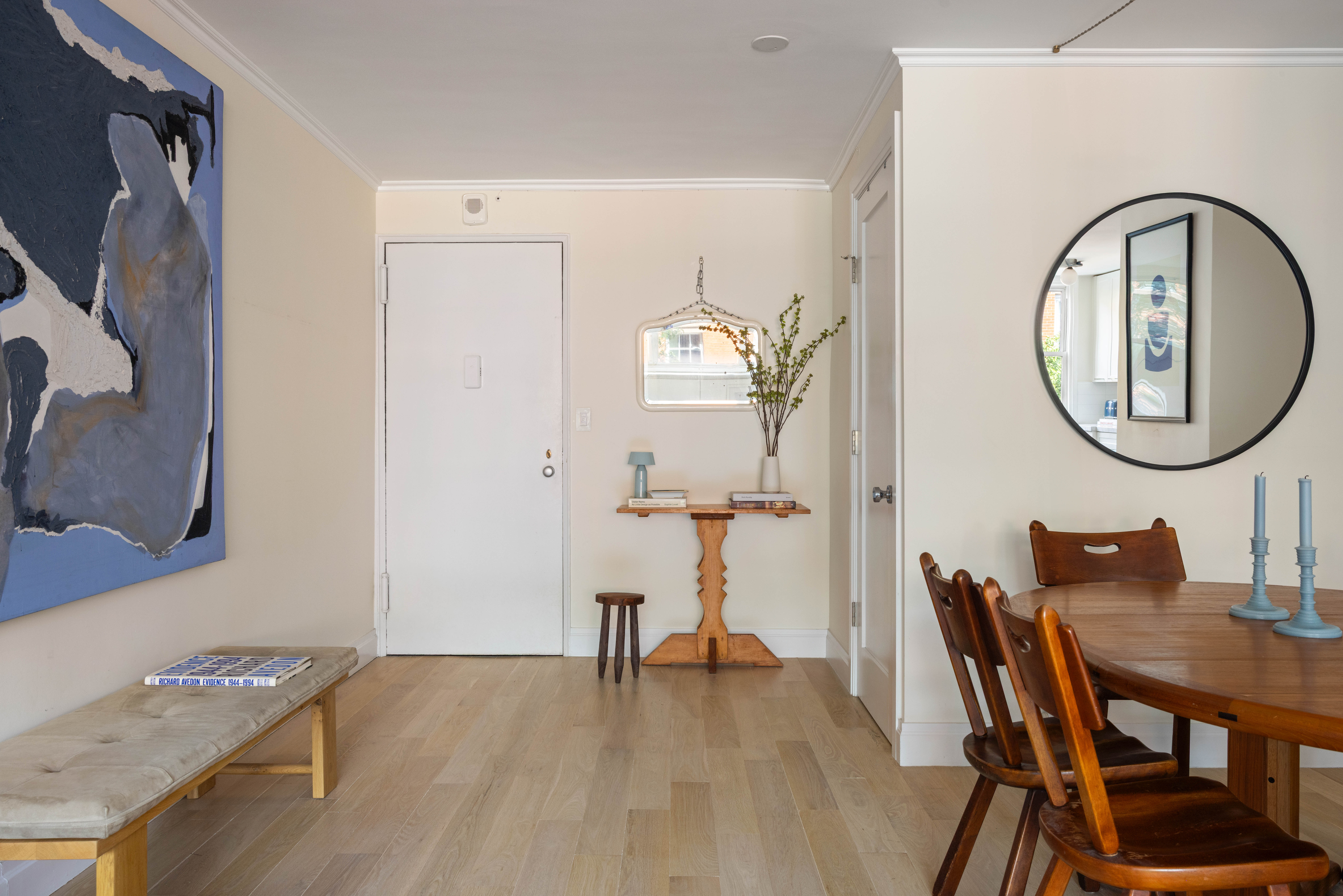 61 Jane Street, Unit 4L Manhattan, NY 10014 - Photo 8 of 11 a view of a dining room with furniture and a mirror