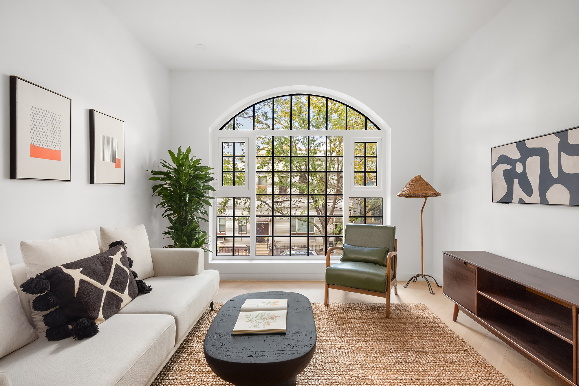 90 Herbert Street, Unit 4A Brooklyn, NY 11222 - Photo 2 of 10 a living room with furniture a rug and a window