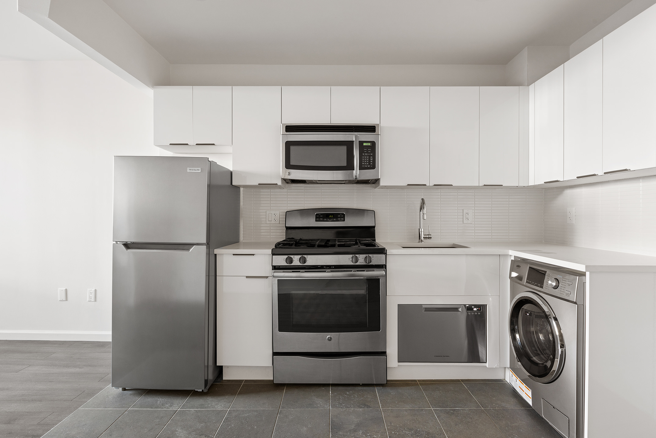 194 East 2nd Street, Unit 3A Manhattan, NY 10009 - Photo 1 of 12 a kitchen with a stove and a refrigerator