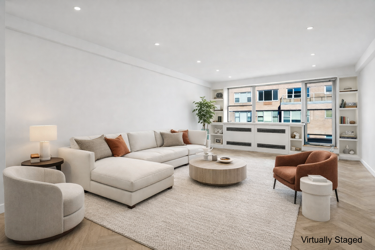 45 Sutton Place South, Unit 20D Manhattan, NY 10022 - Photo 3 of 12 a living room with furniture and a book shelf