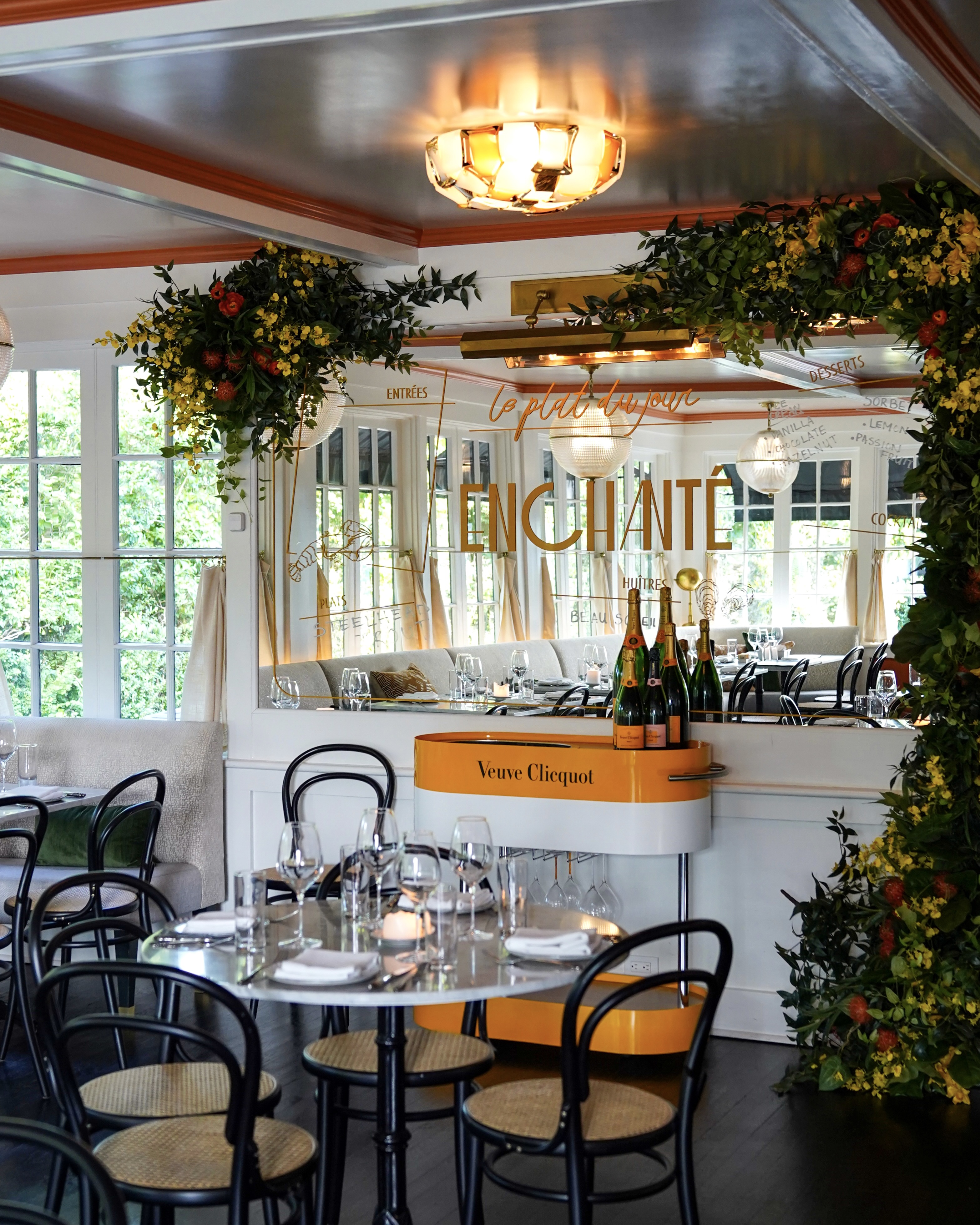 210 Hampton Road Southampton, NY 11968 - Photo 25 of 34 a dining room filled with lots of furniture and a chandelier