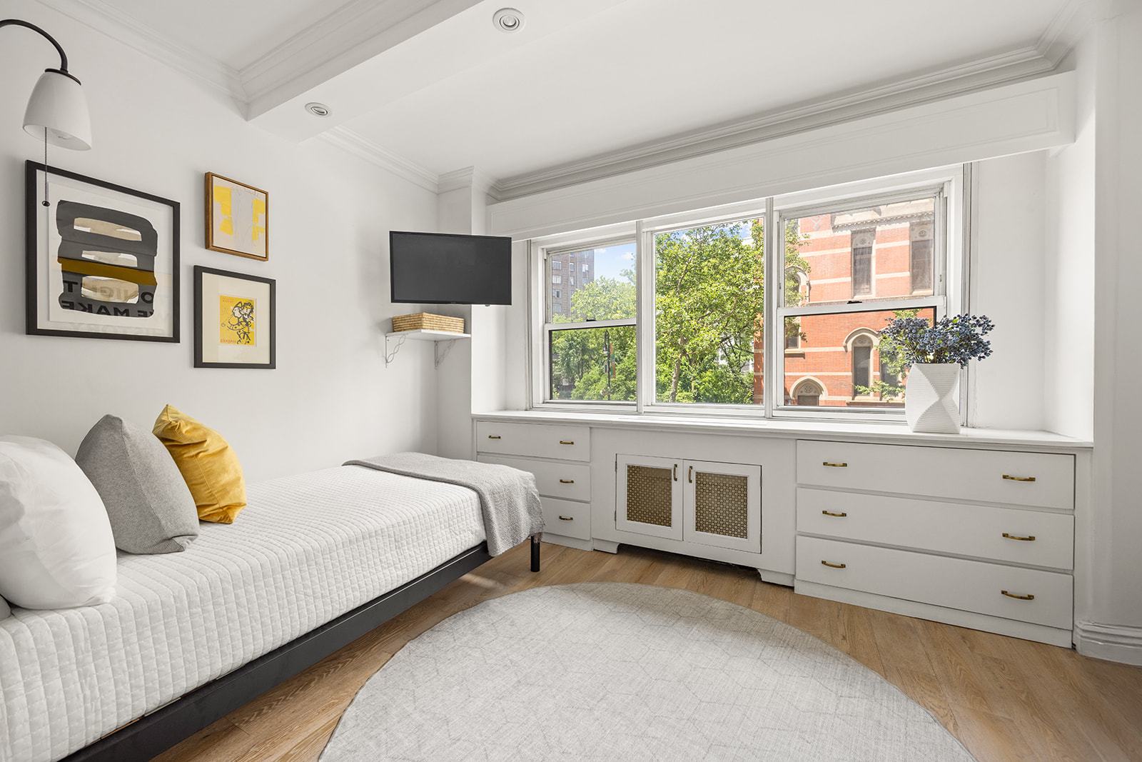 69 West 9th Street, Unit 2B Manhattan, NY 10011 - Photo 12 of 18 a bedroom with a bed and a window