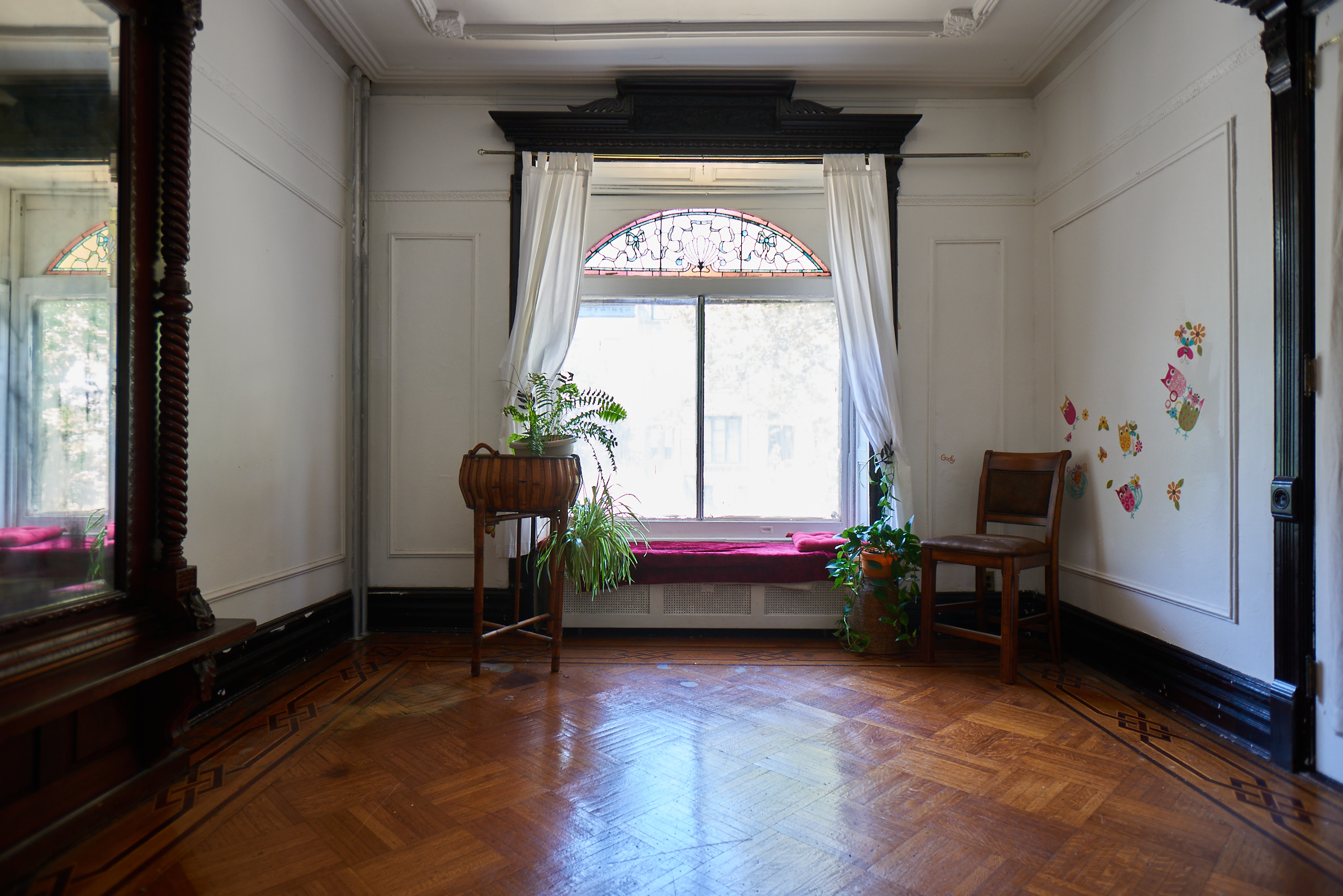 660 Macon Street Brooklyn, NY 11233 - Photo 9 of 17 a living room with a bed and a large window