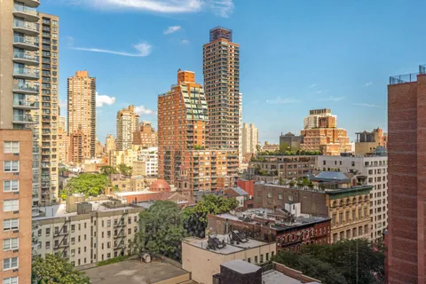 a view of city with tall buildings