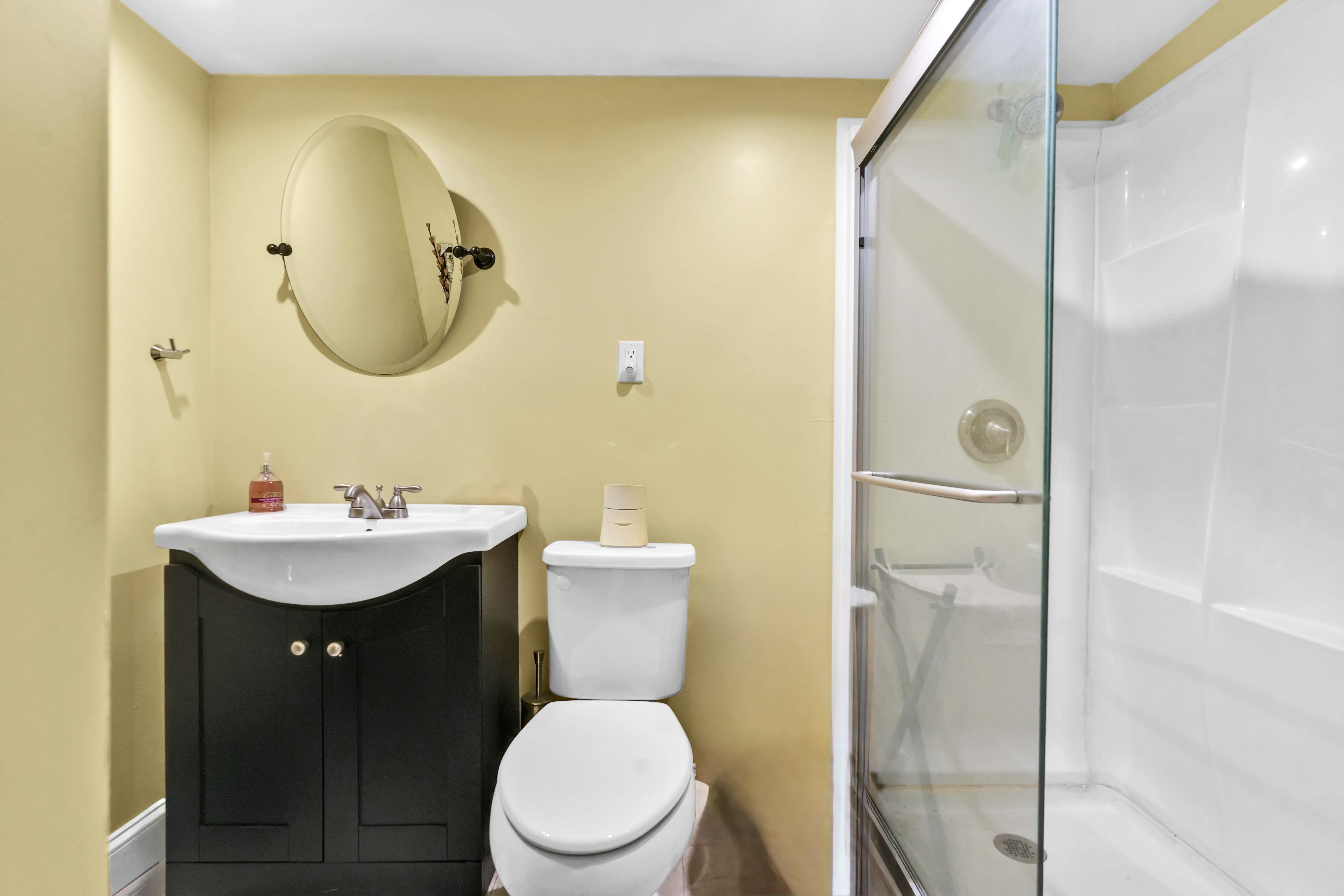 519 Monroe Street Brooklyn, NY 11221 - Photo 53 of 55 a bathroom with a sink mirror toilet and shower