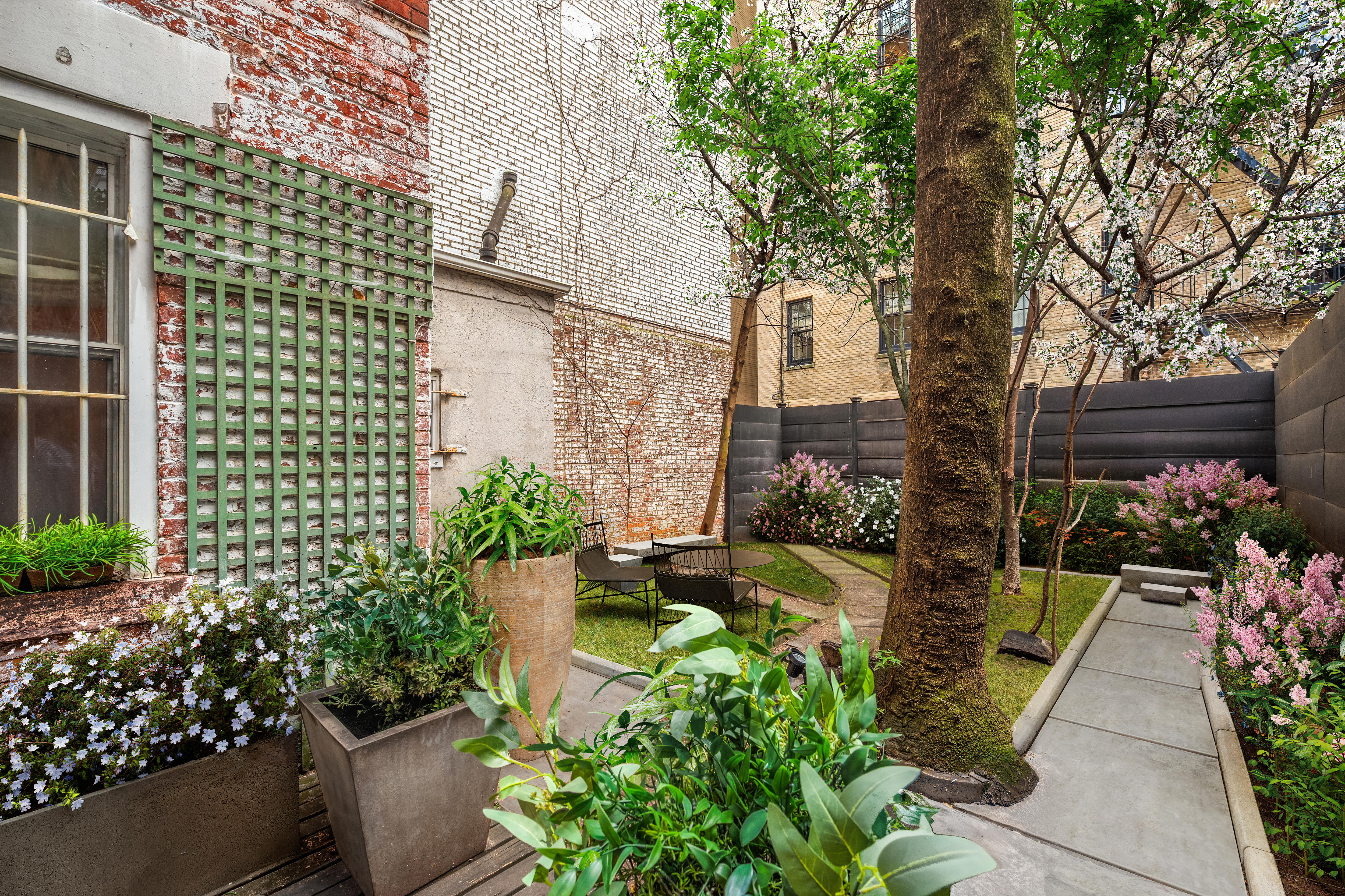 64 East 80th Street Manhattan, NY 10075 - Photo 9 of 14 a view of a garden filled with potted plants
