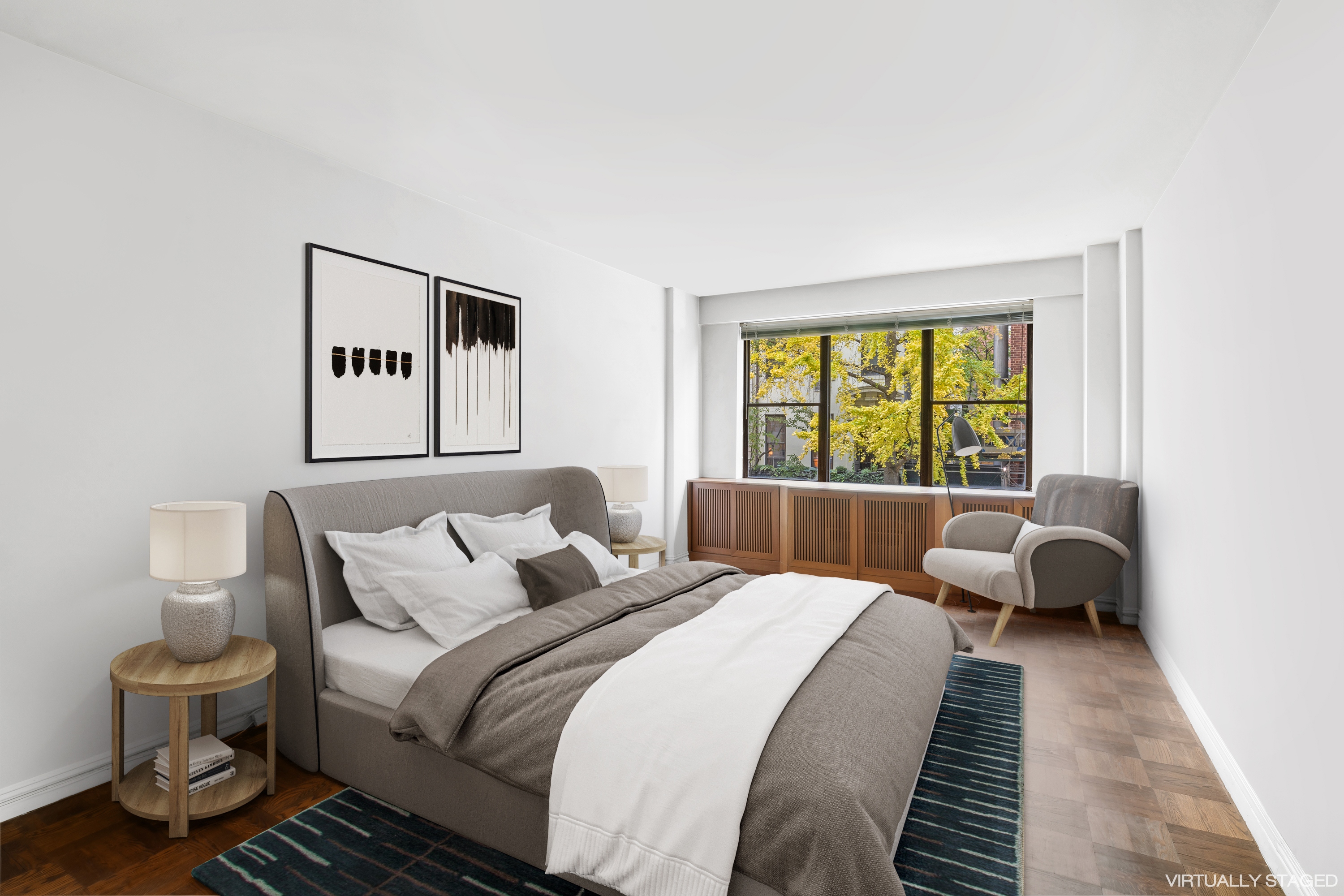 12 Beekman Place, Unit 2F Manhattan, NY 10022 - Photo 3 of 7 a bedroom with a large bed and a window