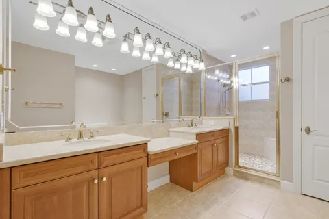 a bathroom with a sink vanity and a mirror