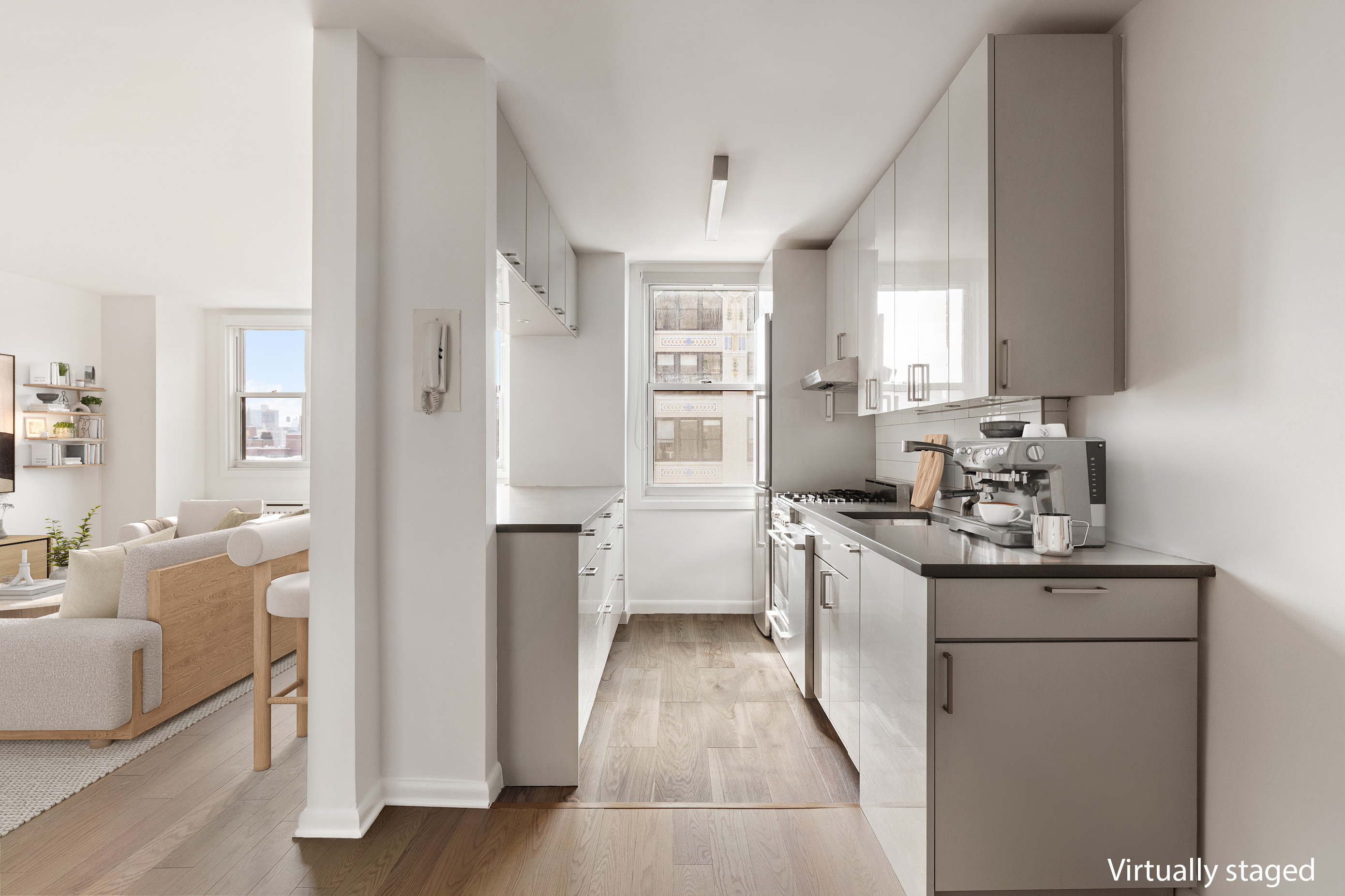 77 7th Avenue, Unit 12P Manhattan, NY 10011 - Photo 8 of 15 a kitchen with white cabinets and sink