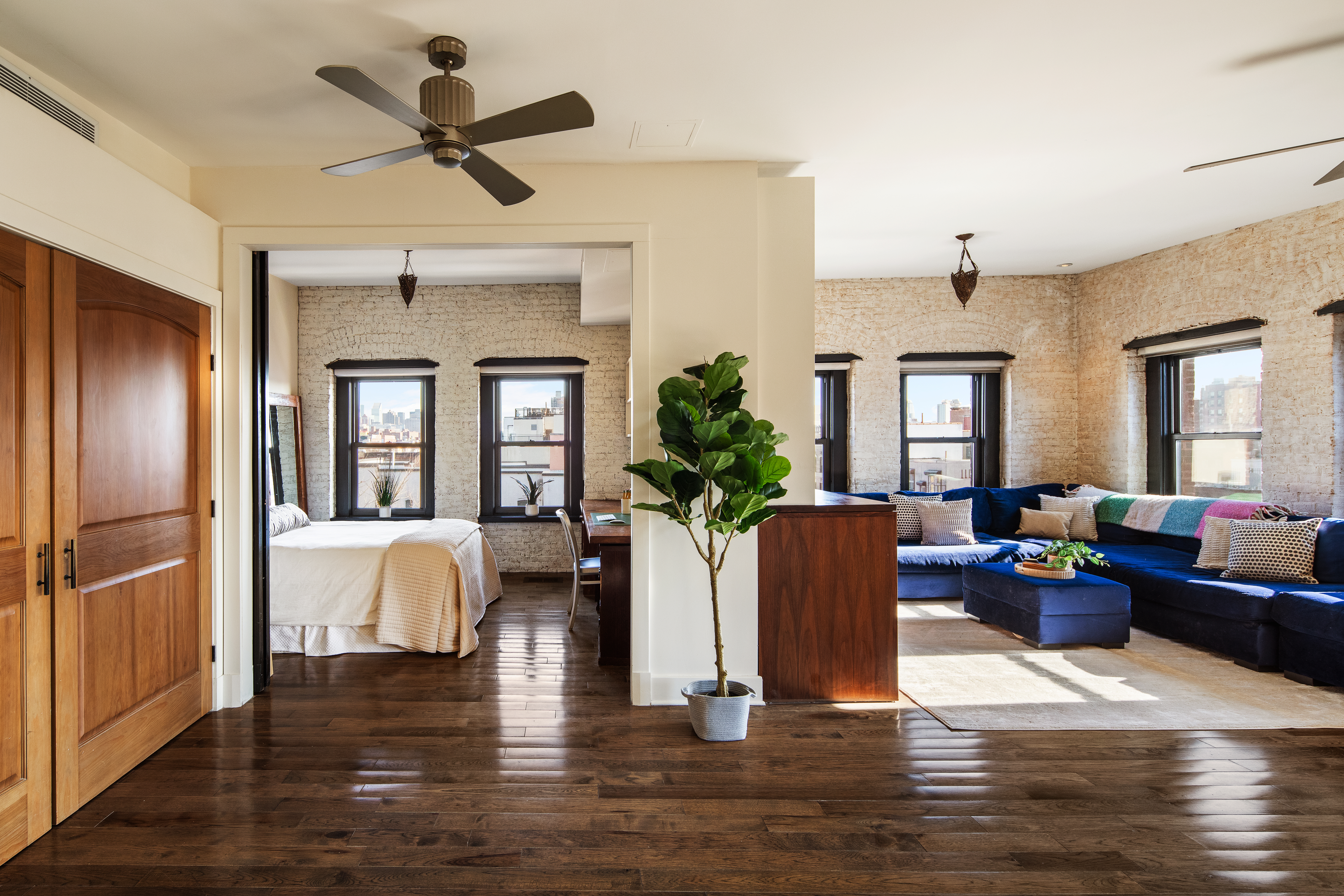 300 East 4th Street, Unit 5CD Manhattan, NY 10009 - Photo 3 of 11 a living room with furniture fireplace and window