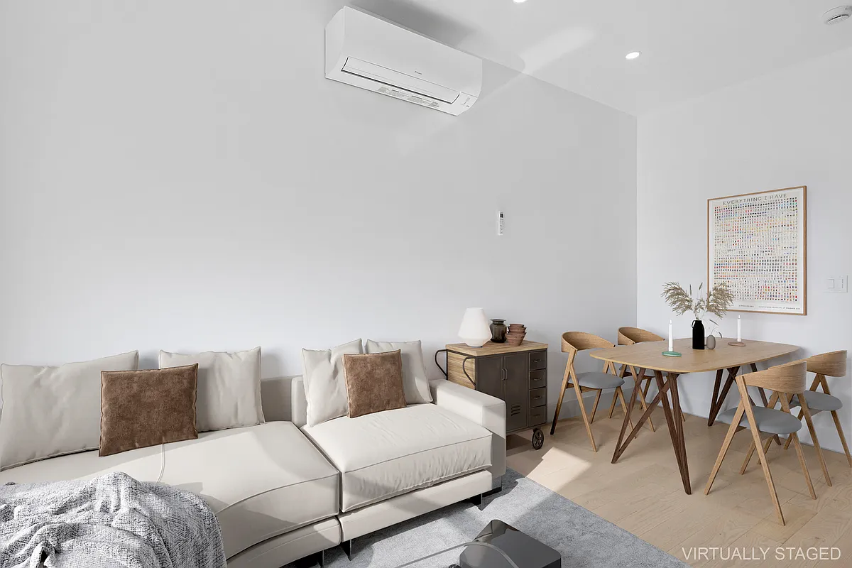 457 Bergen Street, Unit 2F Brooklyn, NY 11217 - Photo 4 of 12 a living room with furniture and a large window