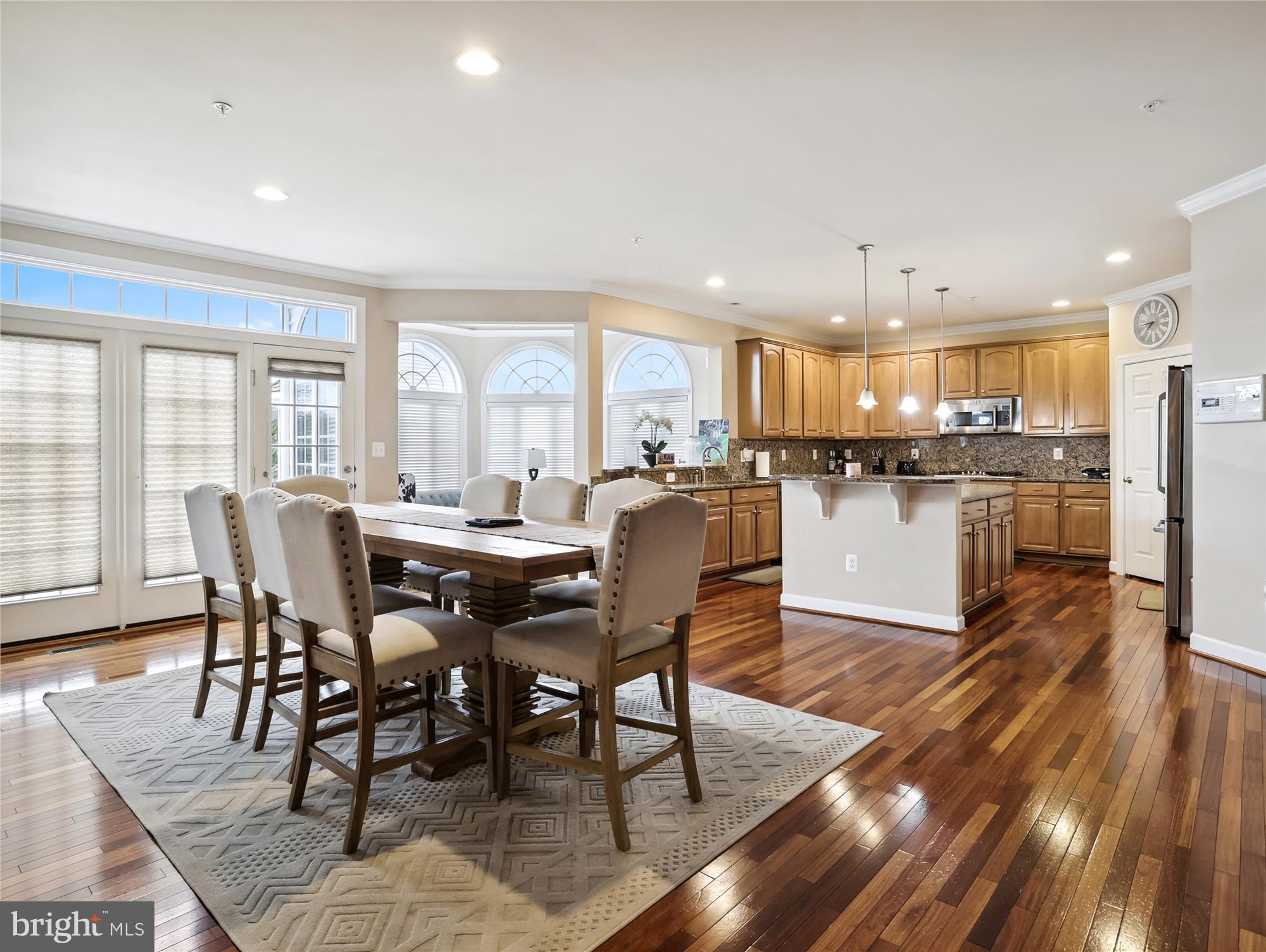 14302 Derby Ridge Road Bowie, MD 20721 - Photo 21 of 67 a view of a dining room and livingroom with furniture wooden floor and a view of kitchen
