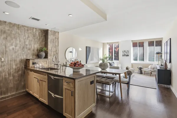 a open kitchen with stainless steel appliances granite countertop a stove and a sink