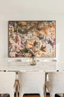 a bedroom with a bed and potted plant