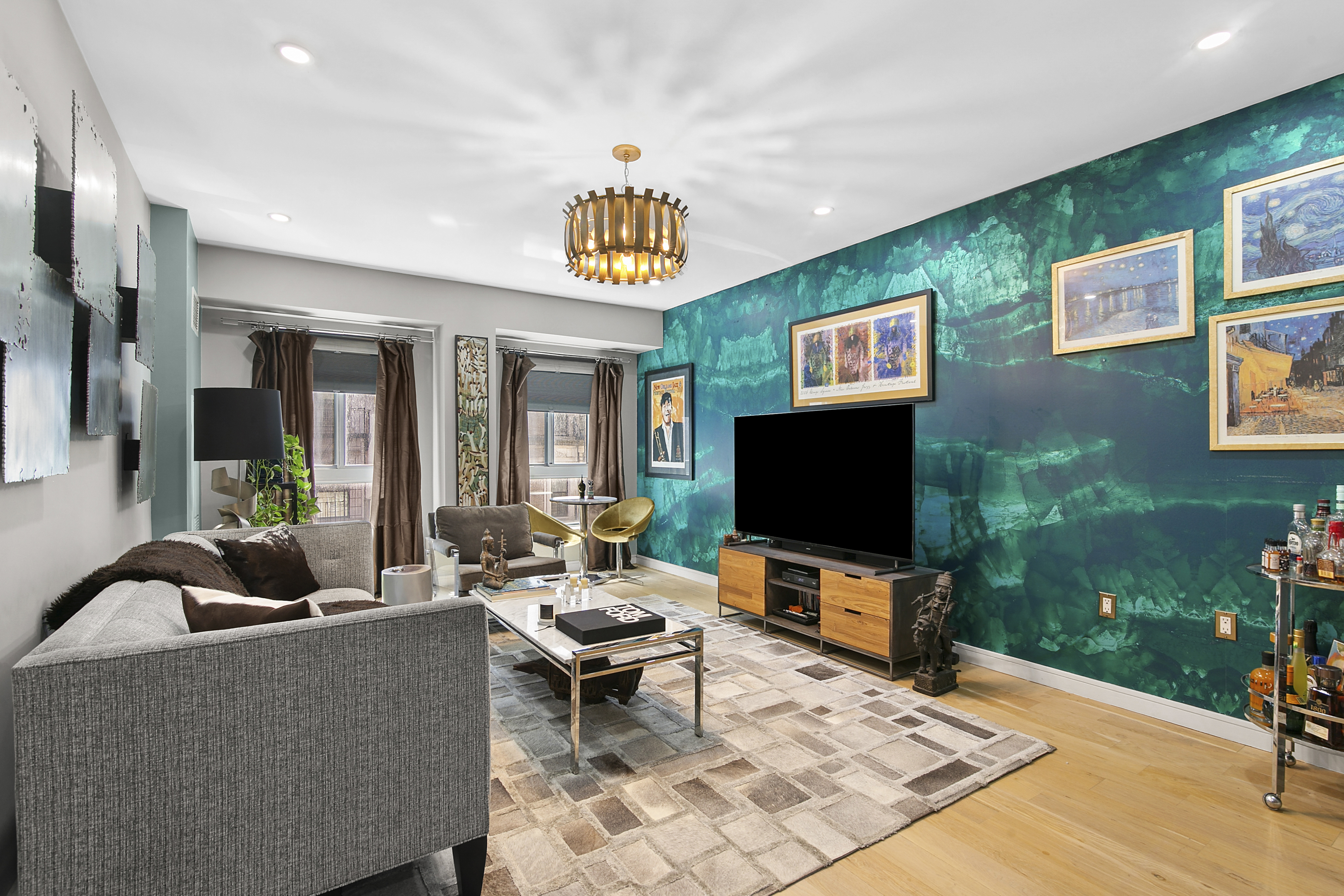 171 West 131st Street, Unit 303 Manhattan, NY 10027 - Photo 2 of 11 a living room with furniture and a flat screen tv