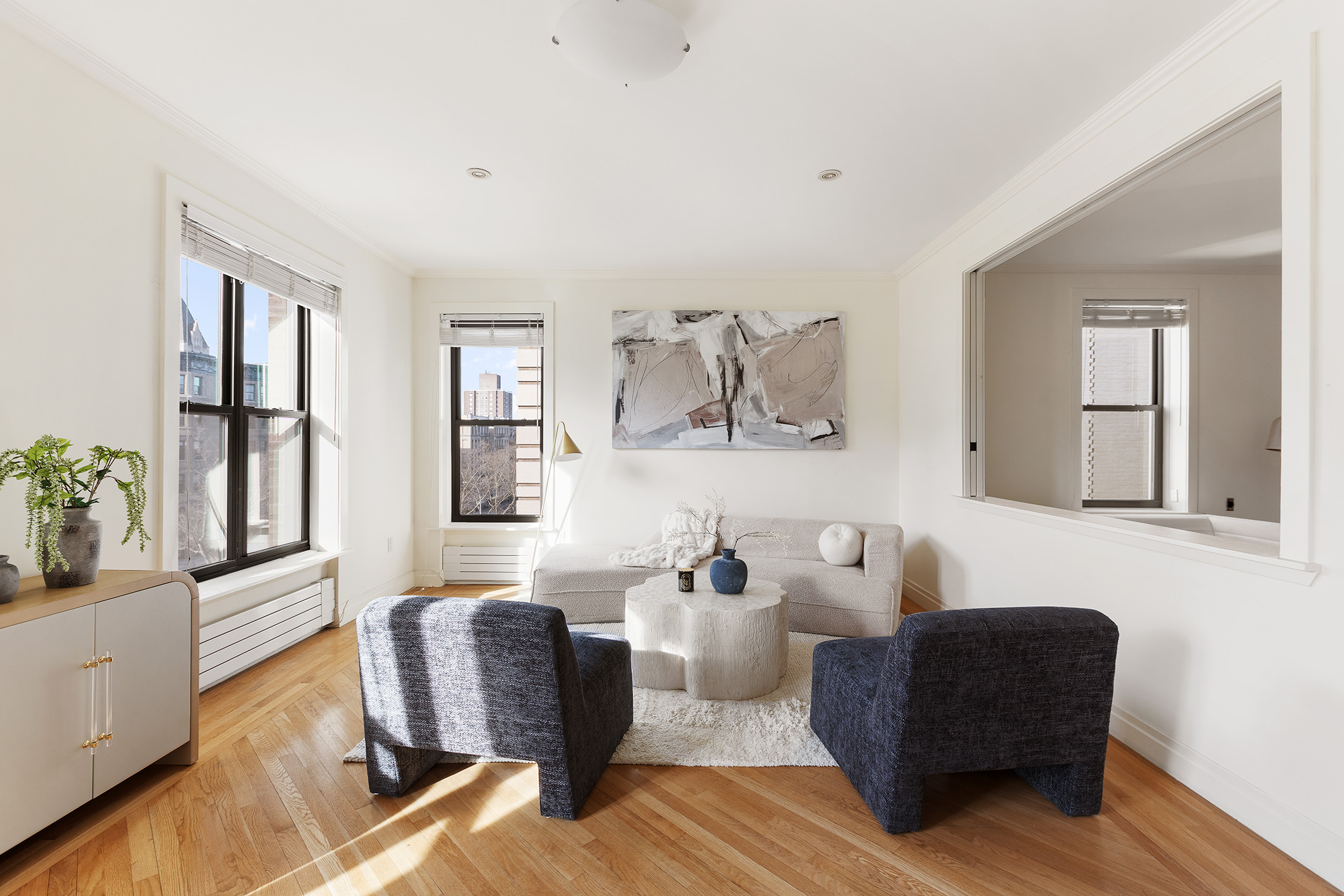 1845 Adam Clayton Powell Jr Boulevard, Unit 5C Manhattan, NY 10026 - Photo 5 of 17 a living room with furniture and a window