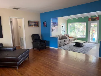 a living room with furniture and a rug