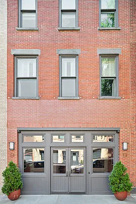 9 College Place, Unit 2K Brooklyn, NY 11201 - Photo 14 of 17 a front view of a brick house with a yard