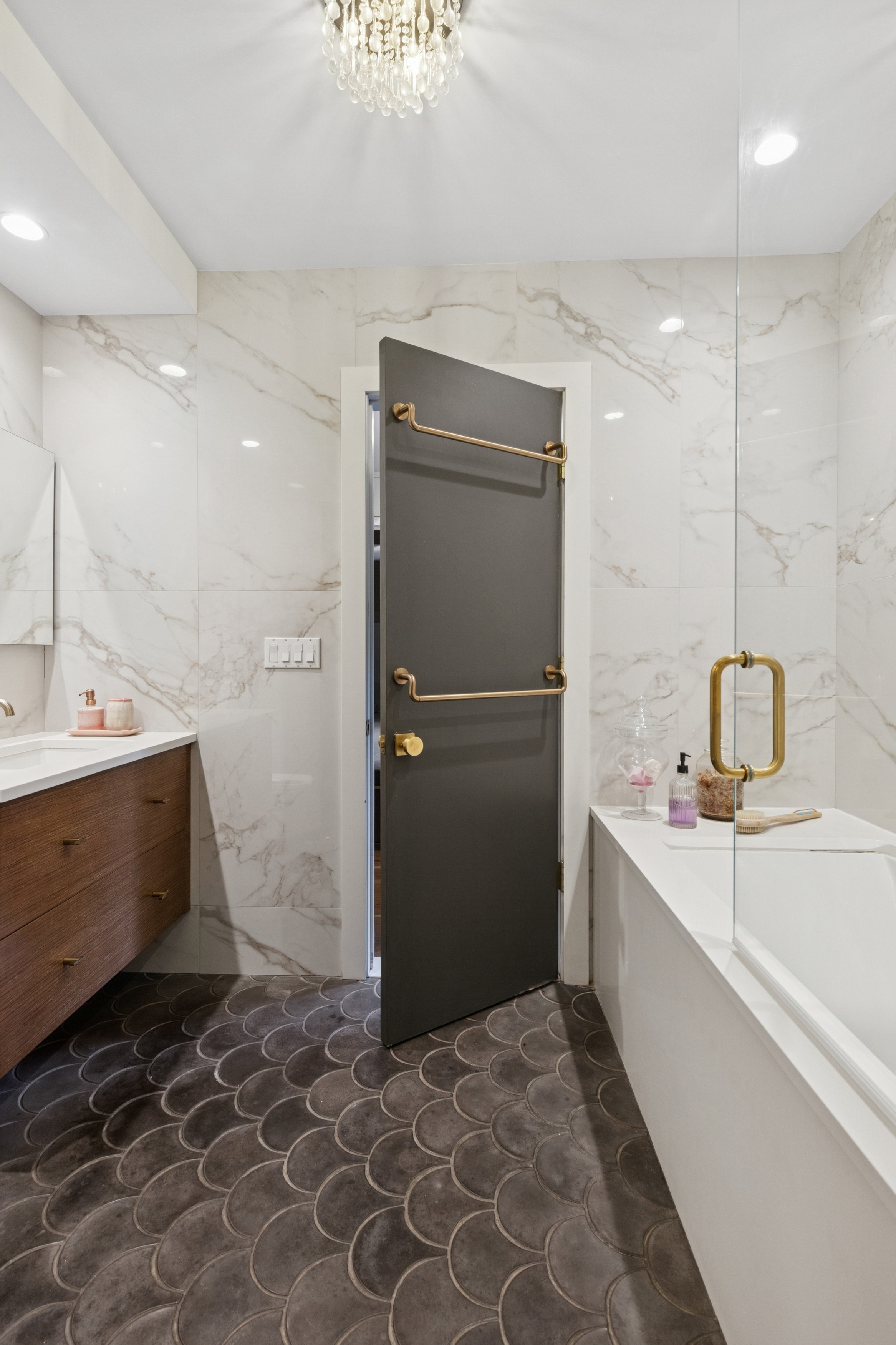 125 Cabrini Boulevard, Unit A22 Manhattan, NY 10033 - Photo 10 of 20 a bathroom with a double vanity sink a toilet and a bathtub