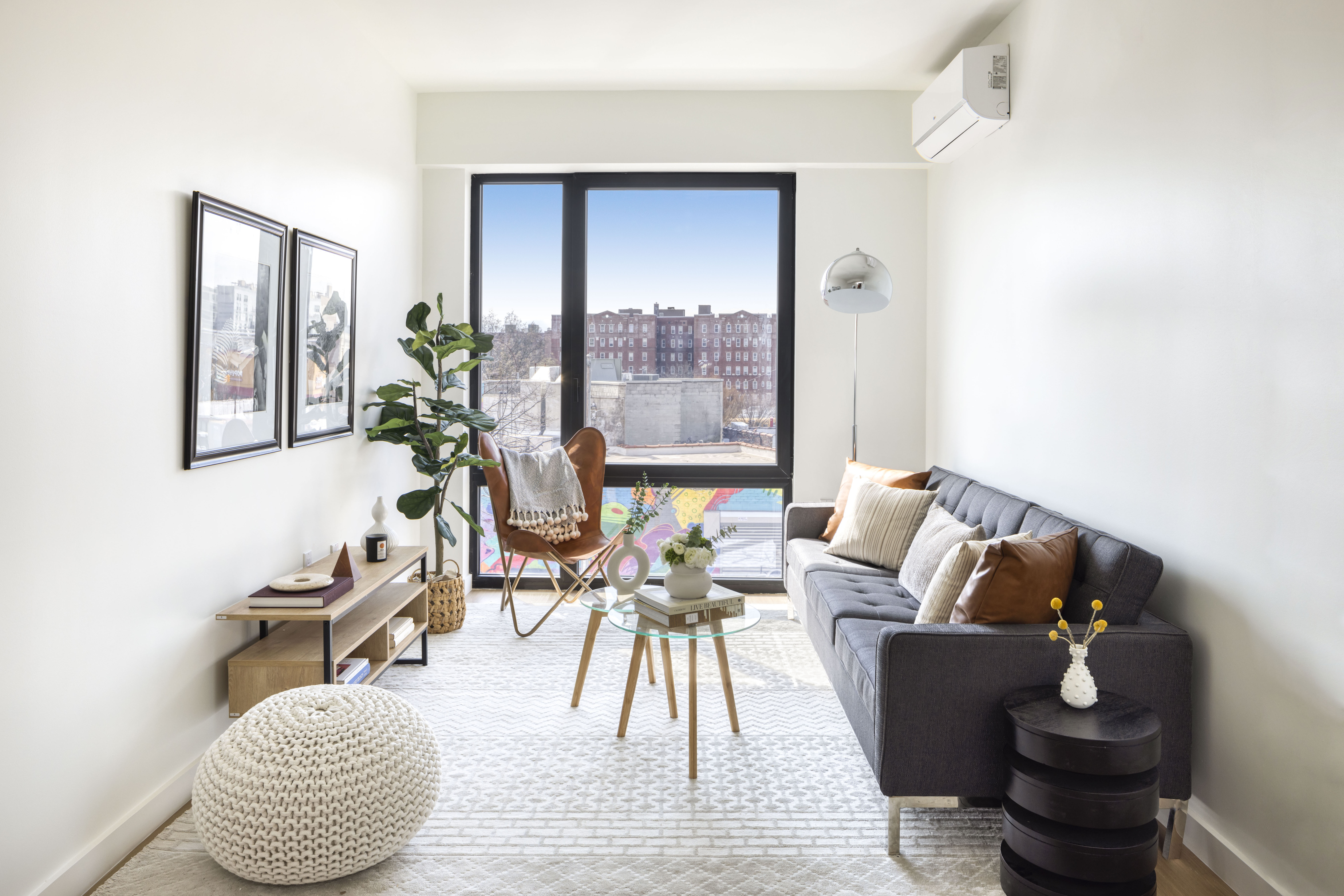 1 Sullivan Place, Unit 11A Brooklyn, NY 11225 - Photo 2 of 7 a living room with furniture and a potted plant