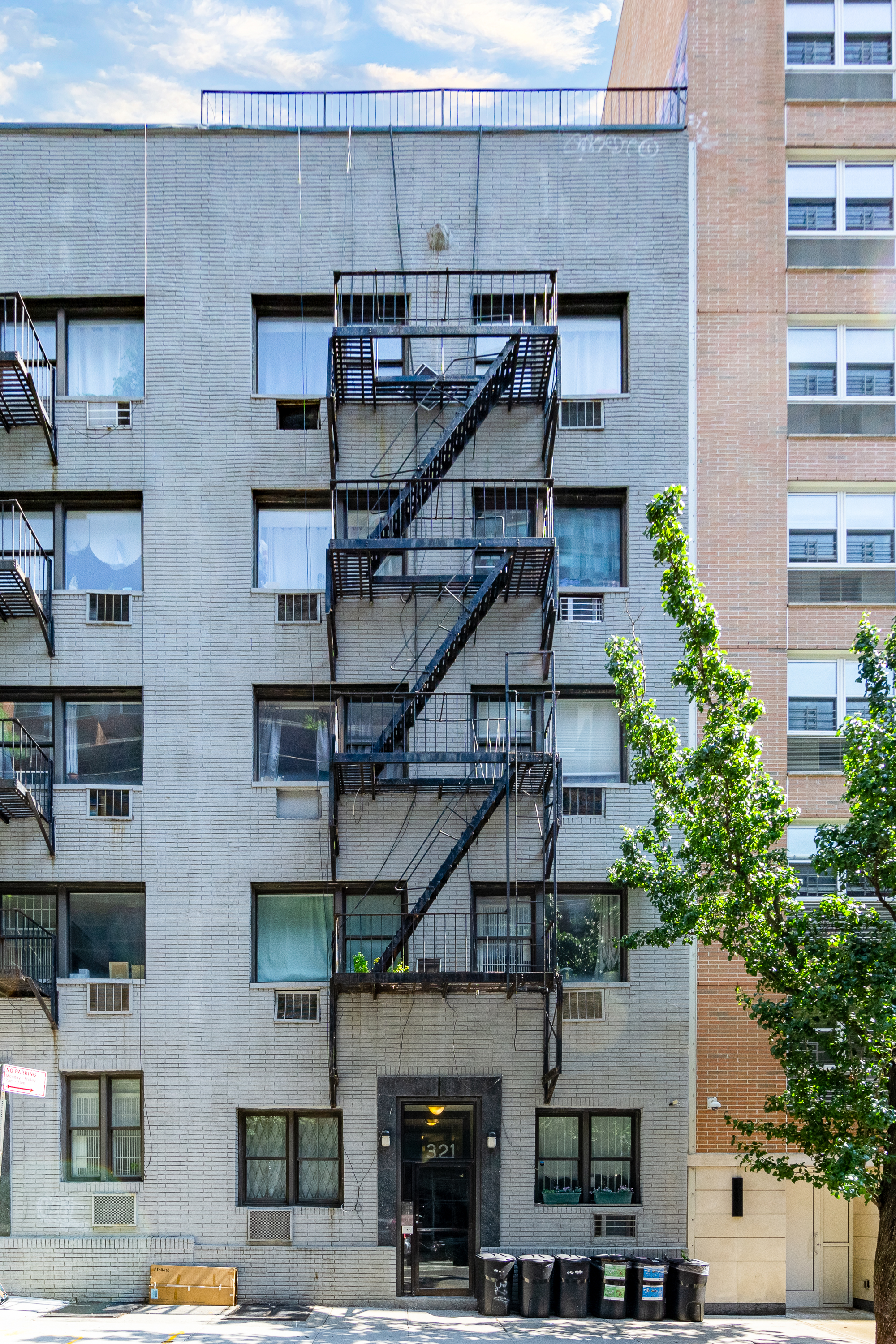 321 East 25th Street, Unit 3A Manhattan, NY 10010 - Photo 9 of 15 a front view of a building with balcony