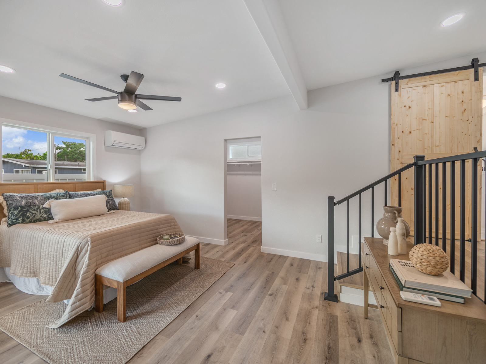 45-561 Paleka Road, Unit C Kaneohe, HI 96744 - Photo 10 of 27 a bedroom with a bed and a chandelier