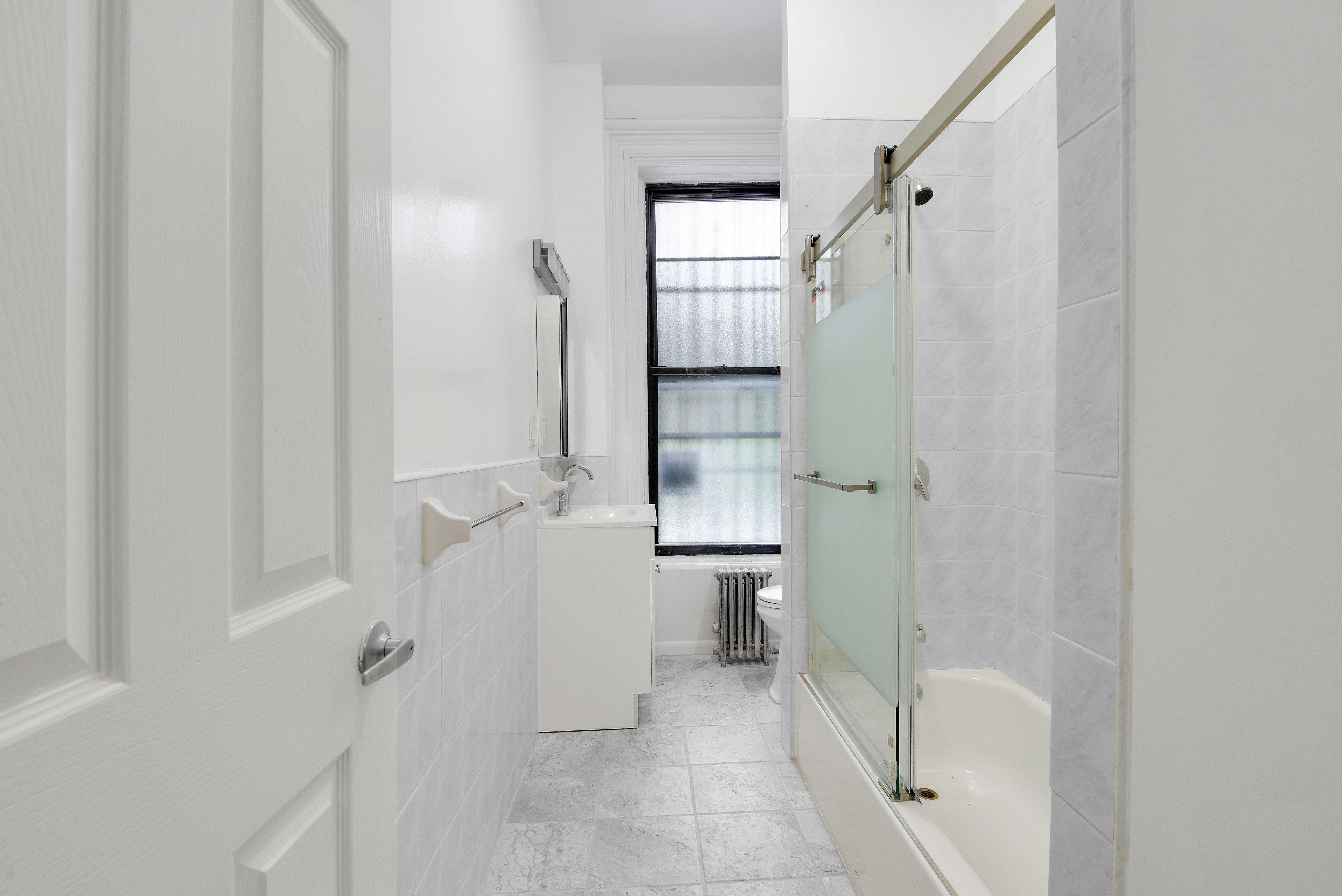 615 Willoughby Avenue, Unit 1 Brooklyn, NY 11206 - Photo 8 of 13 a bathroom with a shower and a toilet