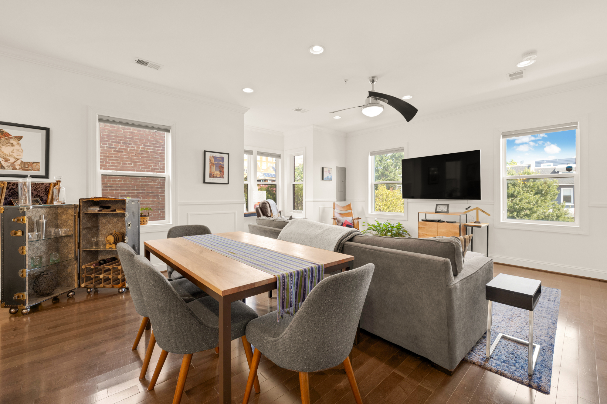 233 S Street Northeast, Unit 4 Washington, DC 20002 - Photo 10 of 37 a living room with furniture a flat screen tv and a dining table