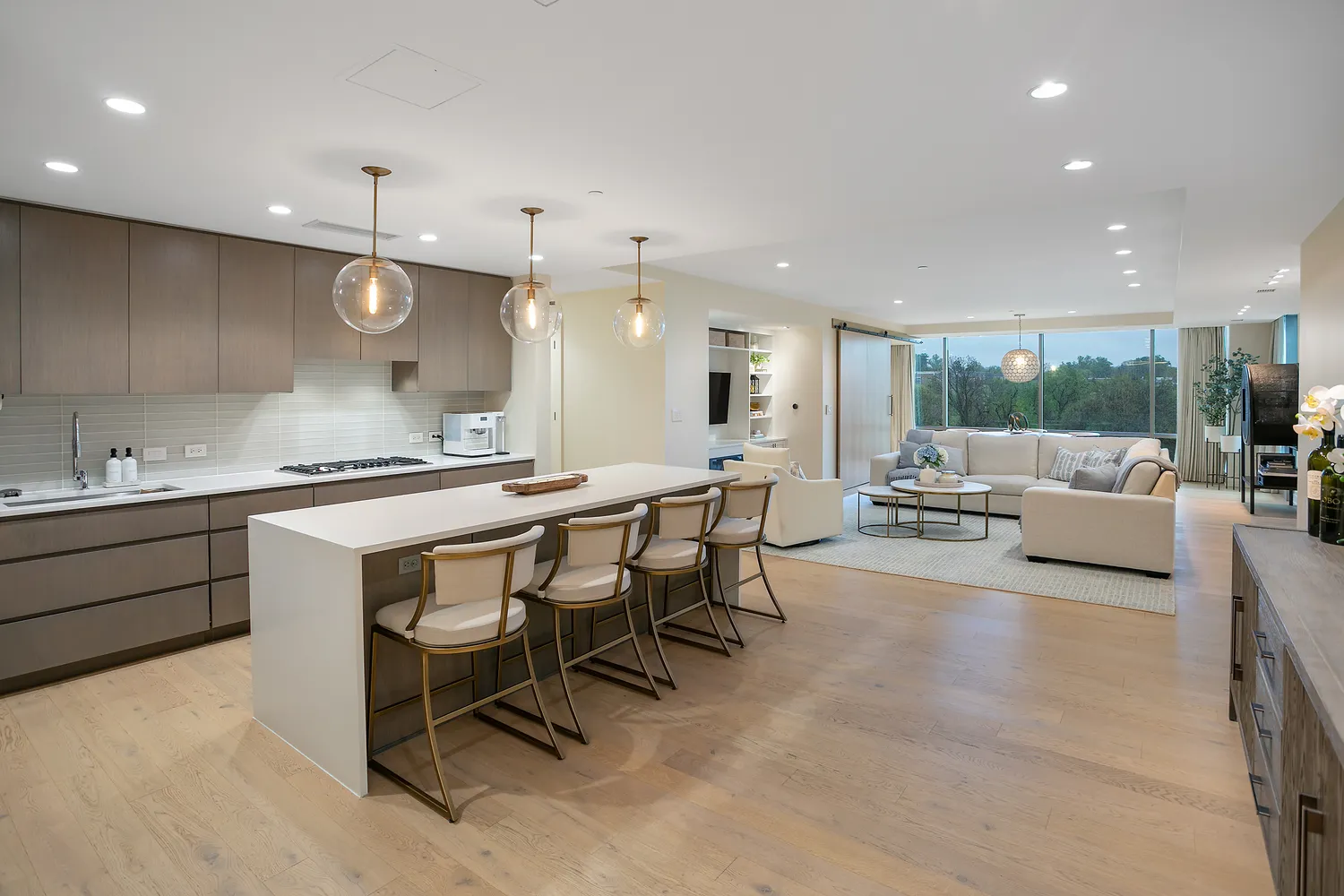 a large kitchen with a table and chairs