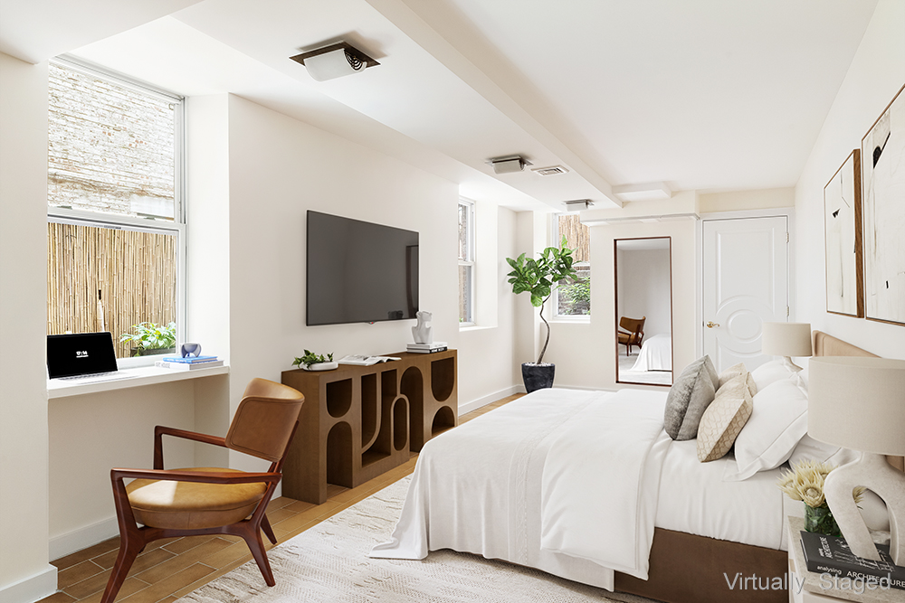 23 East 81st Street, Unit 1 Manhattan, NY 10028 - Photo 2 of 23 a bedroom with a bed and a flat screen tv