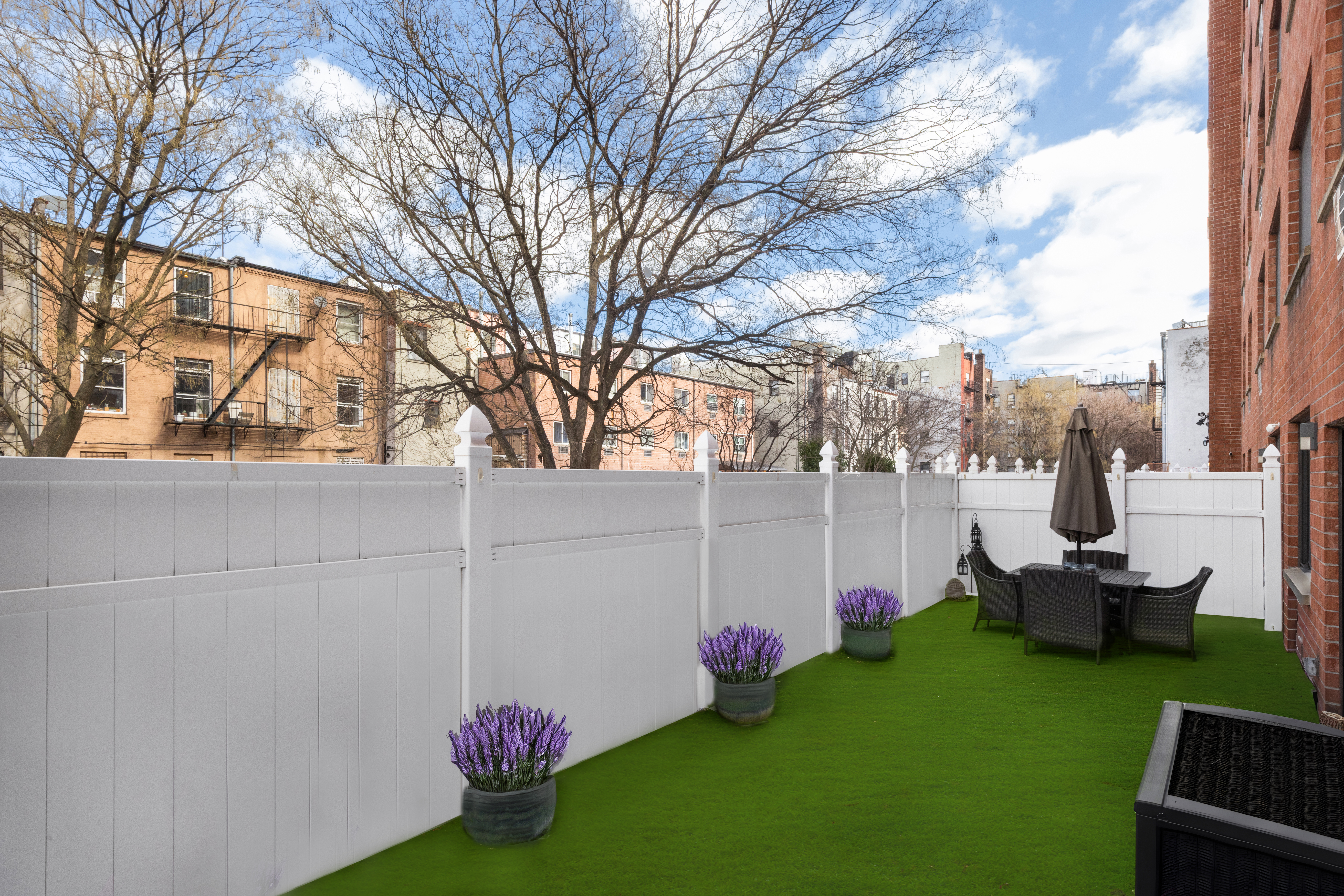 333 East 119th Street, Unit 1H Manhattan, NY 10035 - Photo 3 of 17 a front view of a house with garden