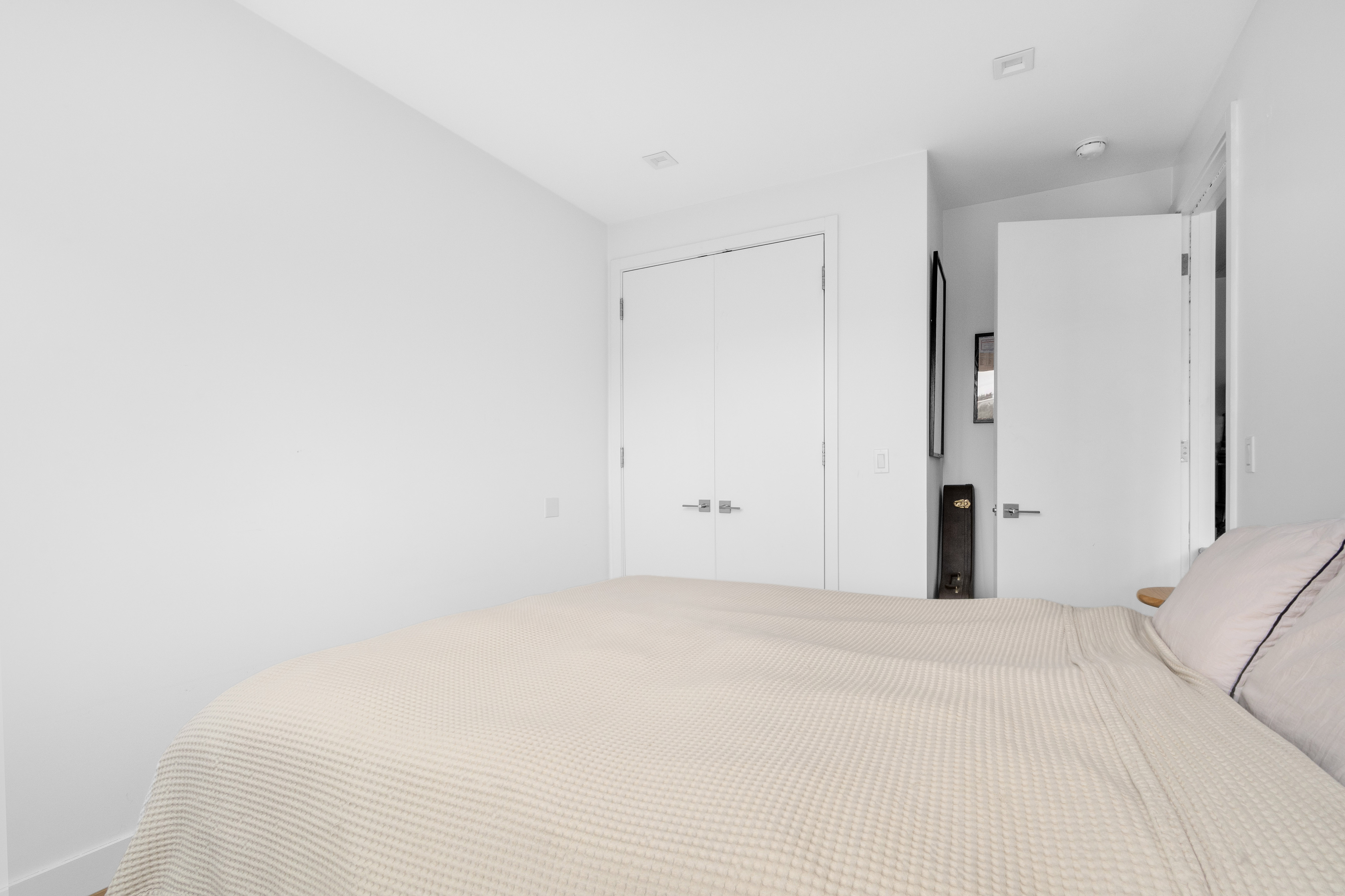 203 Quincy Street, Unit 4B Brooklyn, NY 11216 - Photo 6 of 11 a view of a big room with closet and chandelier fan