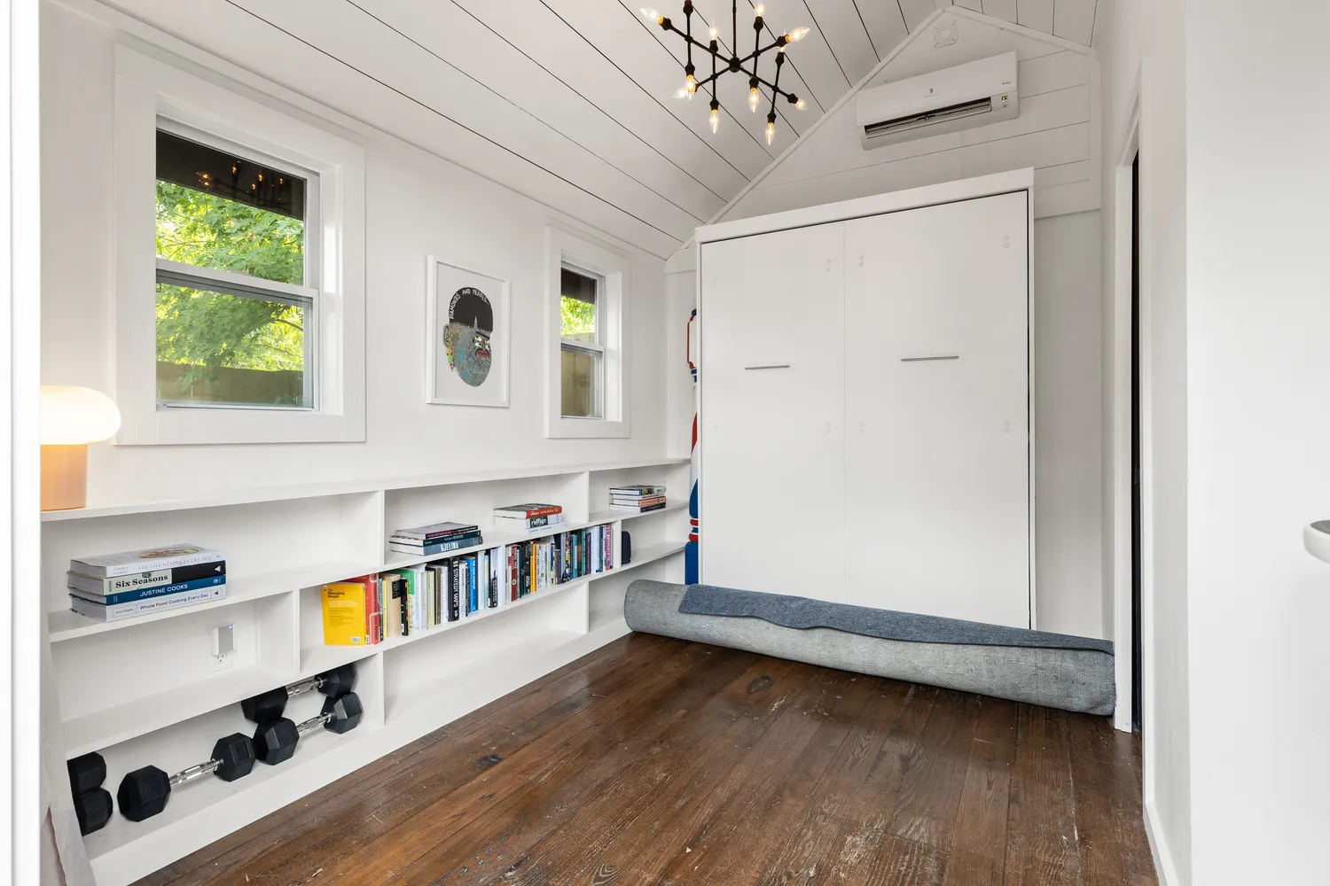 a view of an entryway with wooden floor