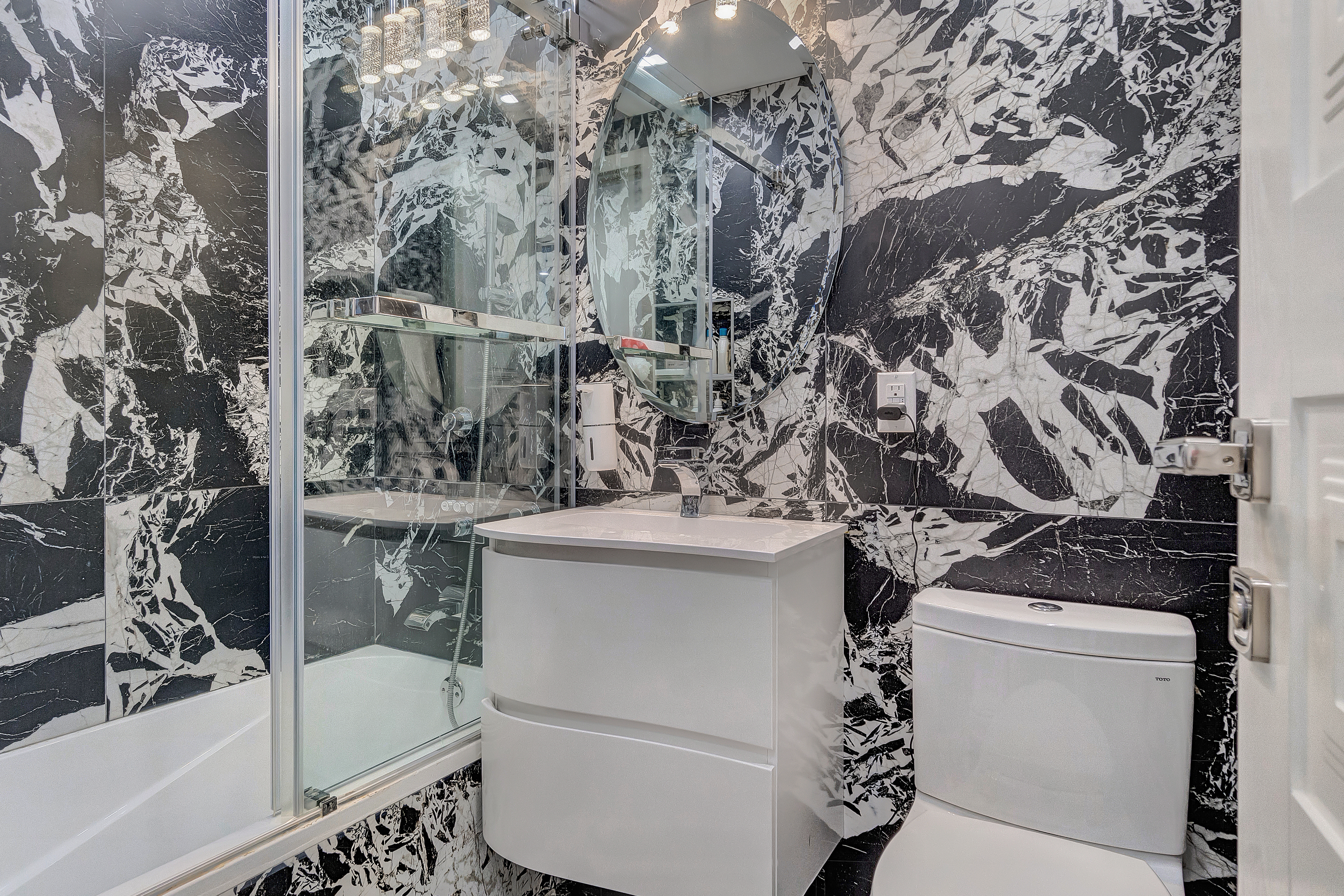 448 Neptune Avenue, Unit 14L Brooklyn, NY 11224 - Photo 12 of 20 a bathroom with a sink toilet and tub