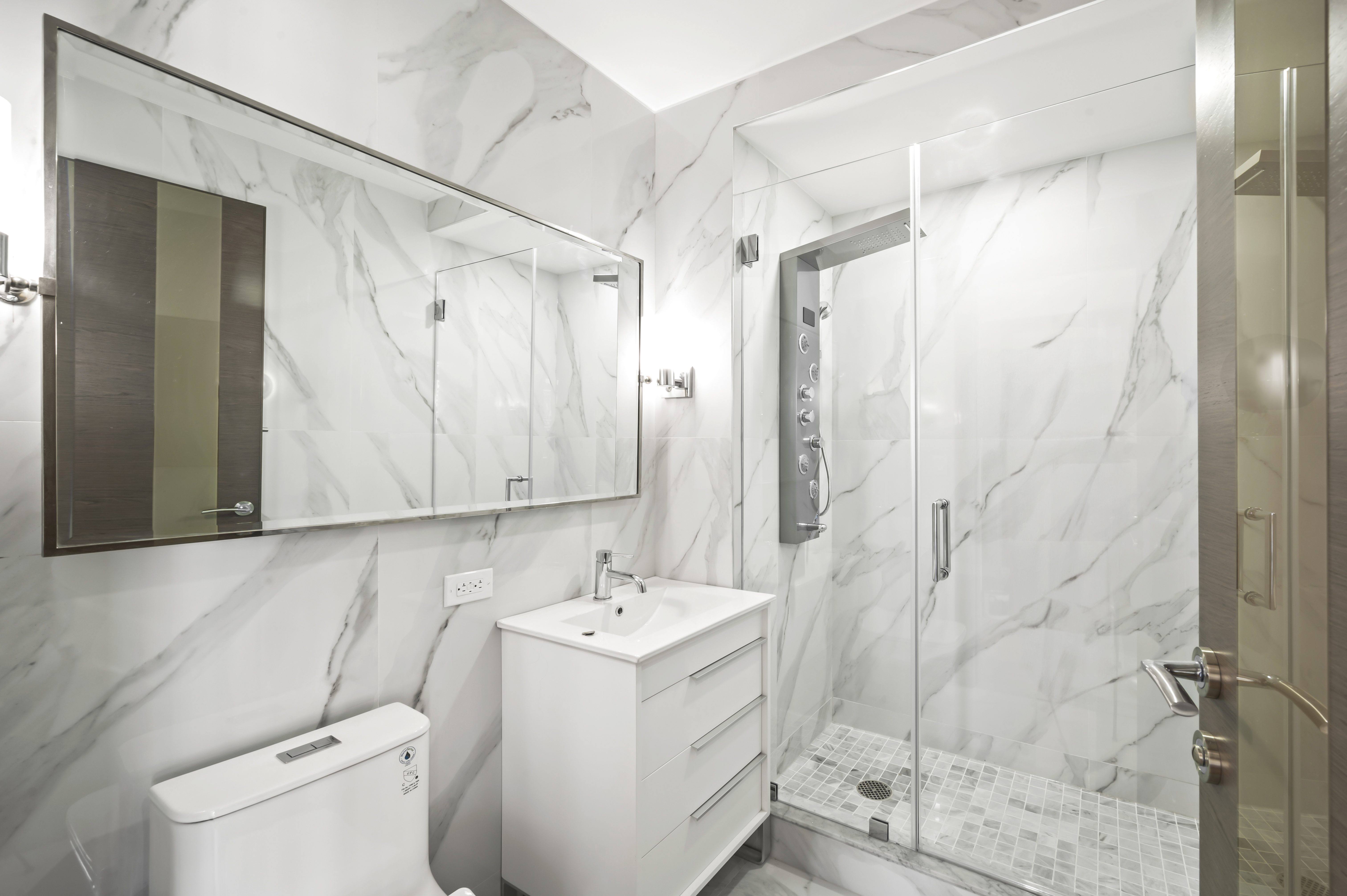 408 East 79th Street, Unit 16B Manhattan, NY 10075 - Photo 14 of 16 a view of bathroom with a sink and mirror